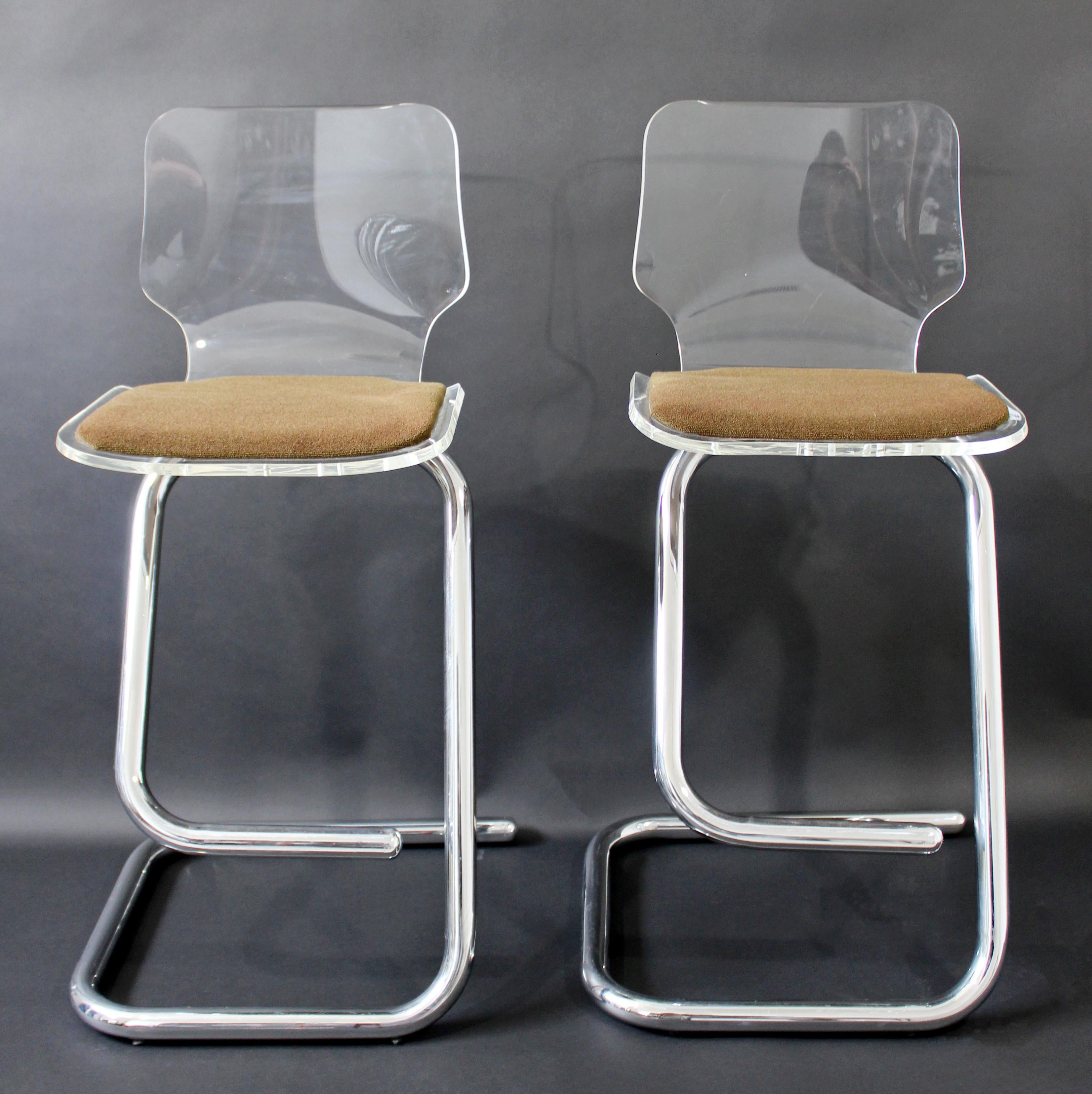 For your consideration is a chic pair of lucite bar stools on chrome bases, by Charles Hollis Jones for Hill Manufacturing, circa the 1970s. In excellent vintage condition. The dimensions are 17