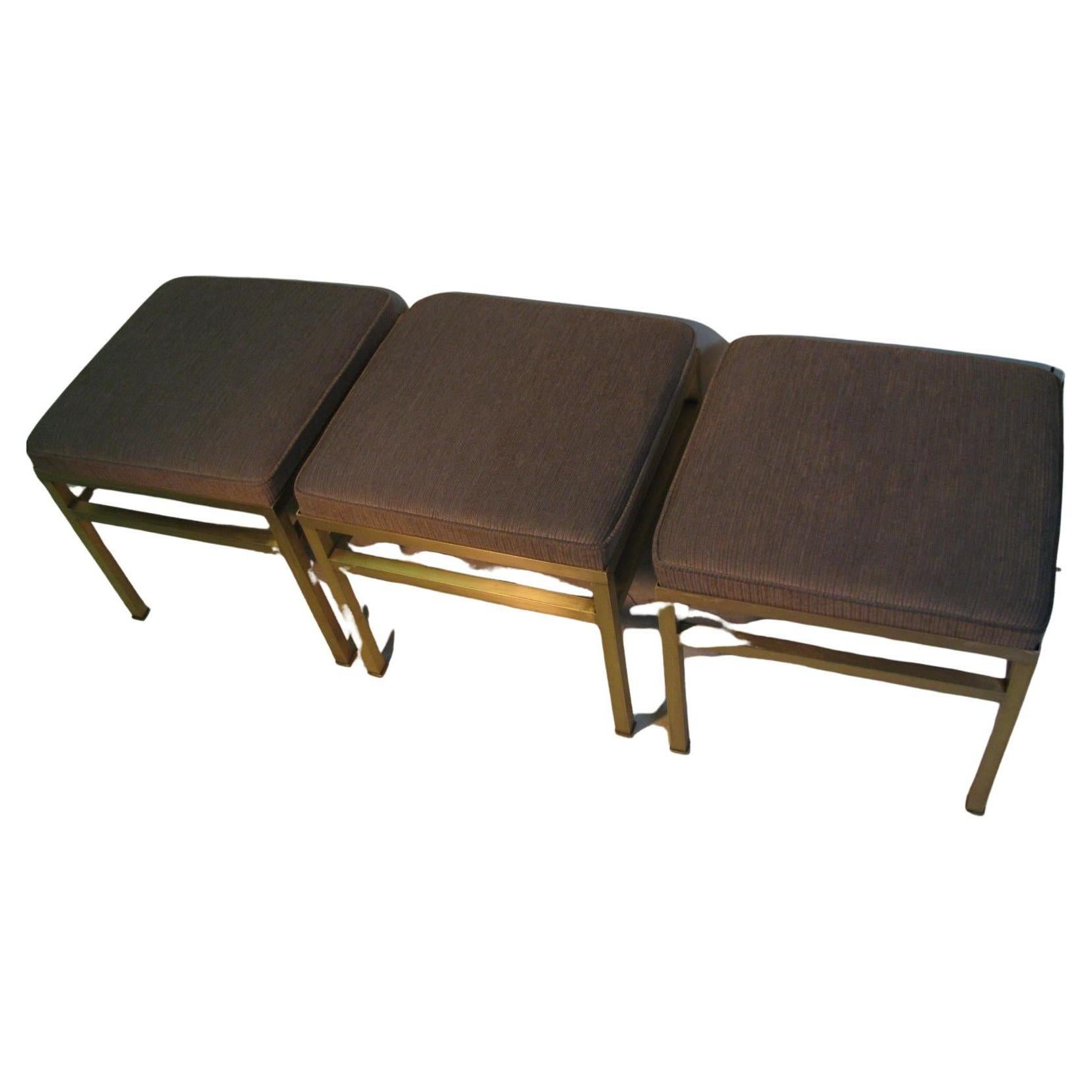 Only 1 available. Fabulous satin brass ottoman - footstool- bench. Reupholstered in a vintage style 1960s weave fabric with fabulous coloring that contrasts greatly with the brass. Square tube brass is in very good condition with no tarnish just