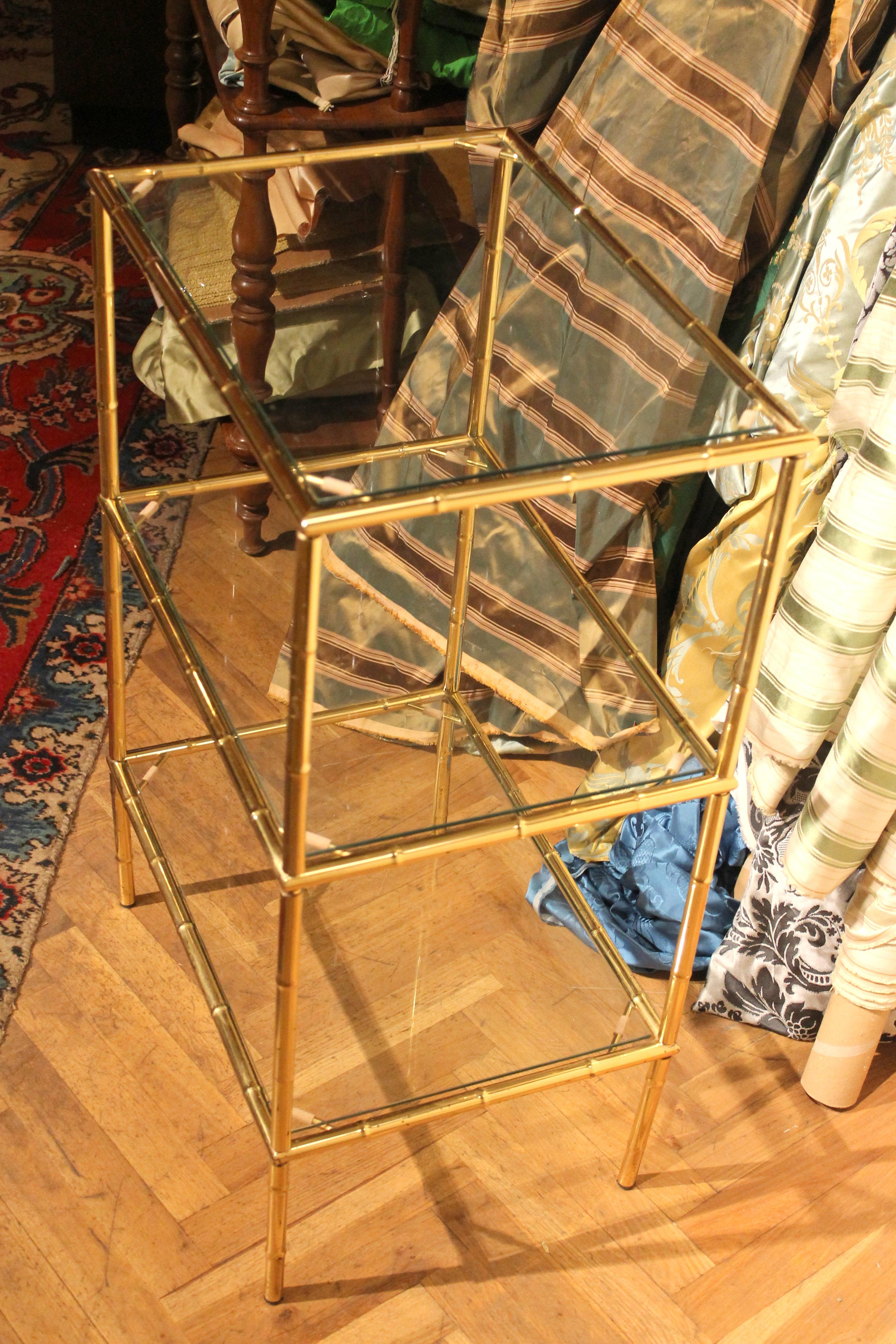 Add a touch of European glamour to your home with this stylish gilt metal three-tiered table in the style of the Maison Baguès.
This French Mid-Century Modern étagère, crafted with popular faux bamboo motif, features clean lines and a modern,