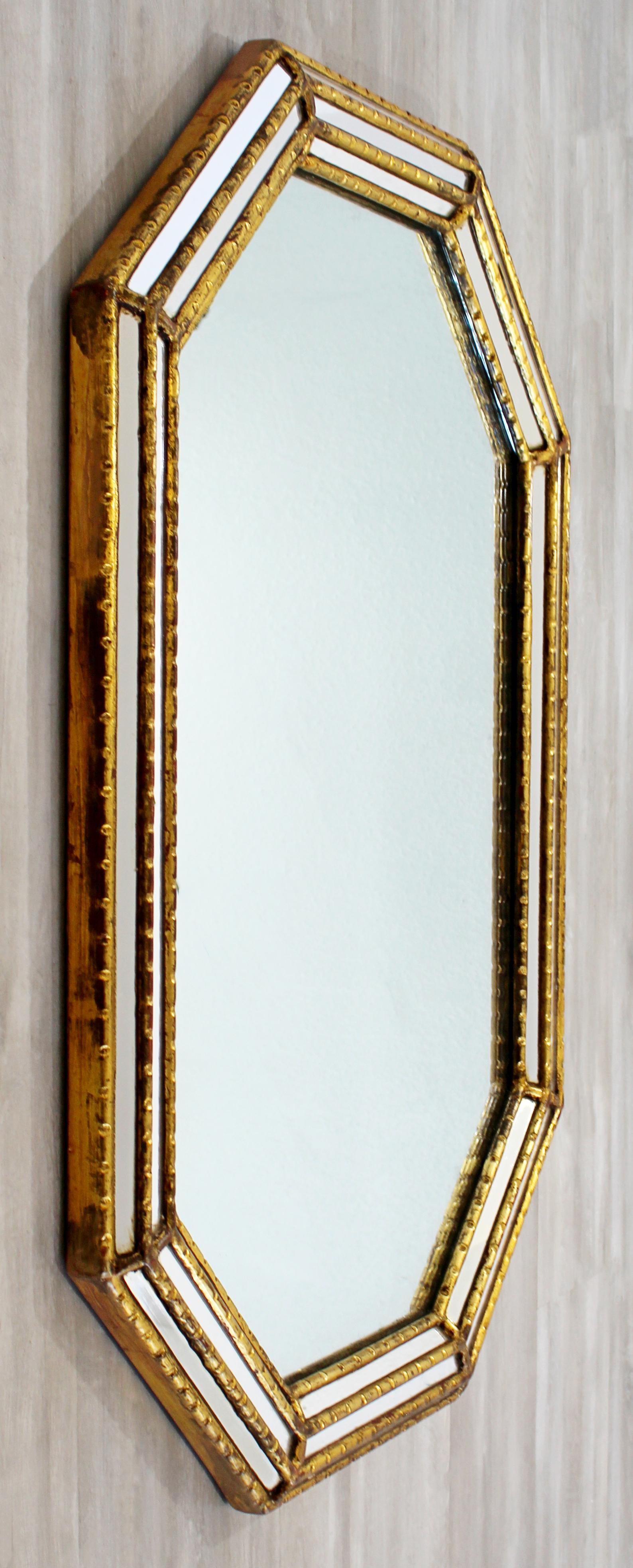 For your consideration is a great, beveled, gold giltwood wall mirror, made in Italy, circa 1960s. By Fratelli Paoletti. In good vintage condition. The dimensions are 29