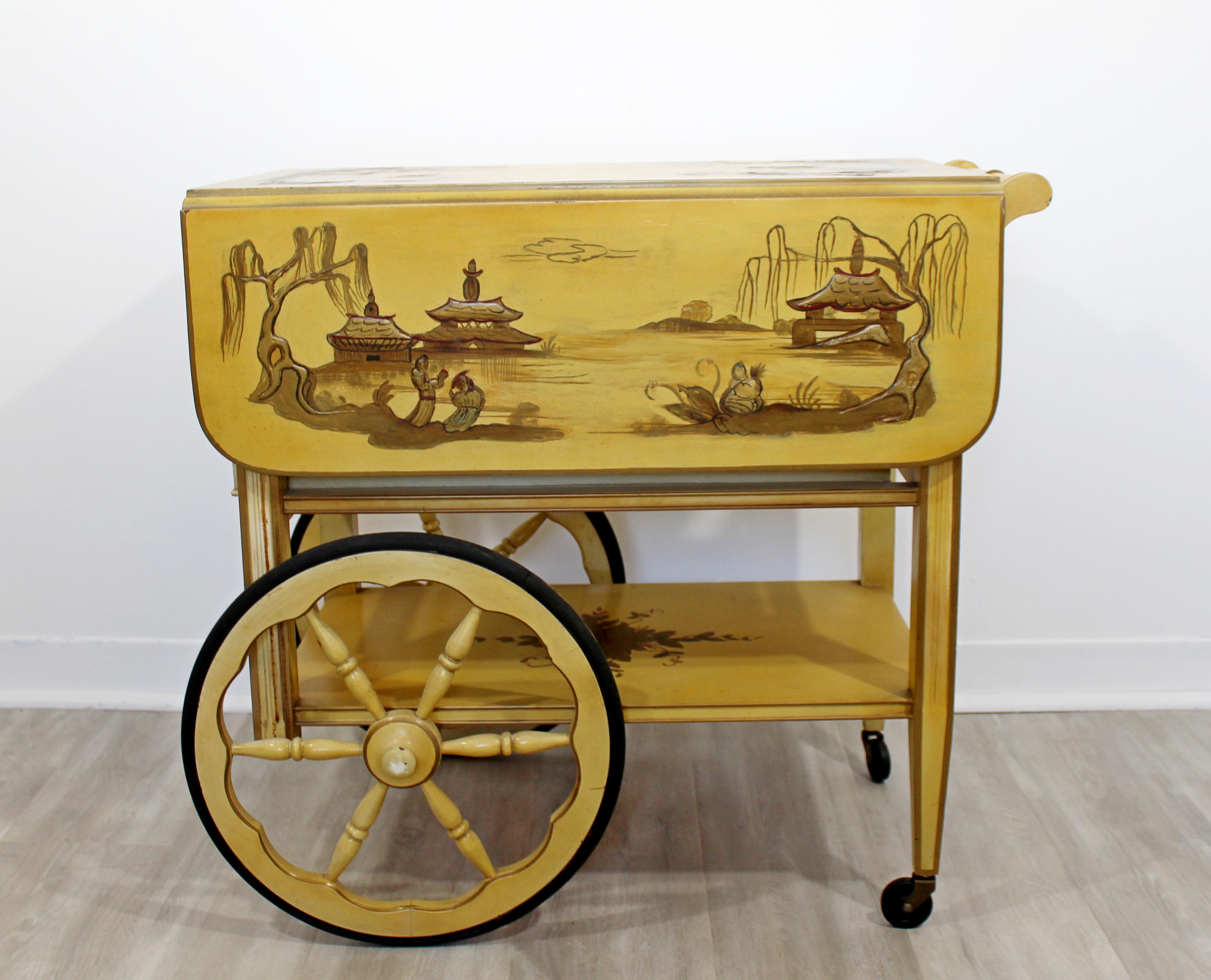 For your consideration is a chinoiserie painted, wood bar, tea serving cart, with a removable tray top, and two wings. Attributed to Dorothy McGuire. In very good vintage condition. The dimensions are 28