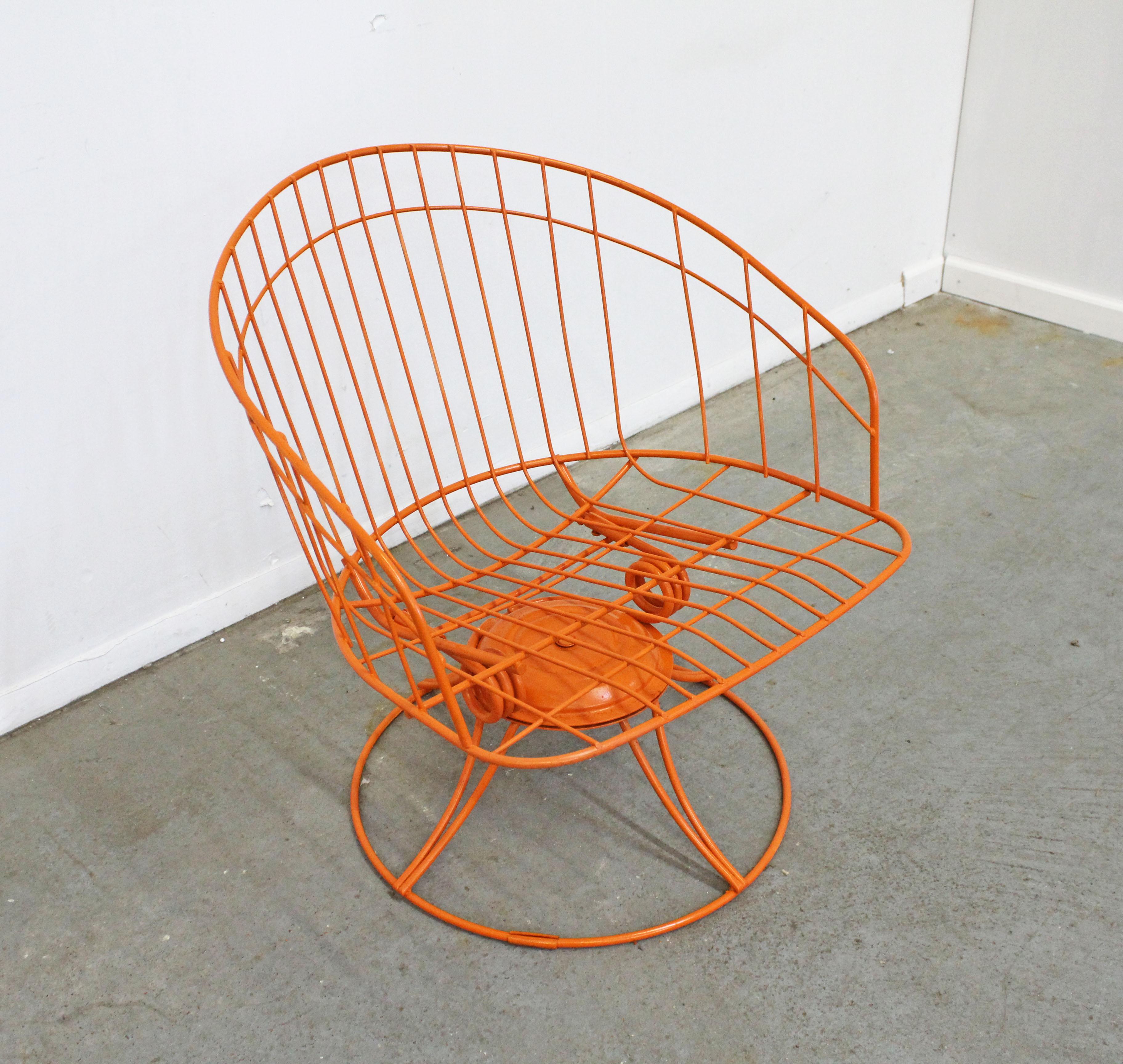What a find. Offered is a midcentury welded steel outdoor/patio 'Kingston' (model 72) swivel rocker made by Homecrest Bottemiller, circa 1968. This piece has been repainted in an atomic orange. It is in good condition considering its age, has new