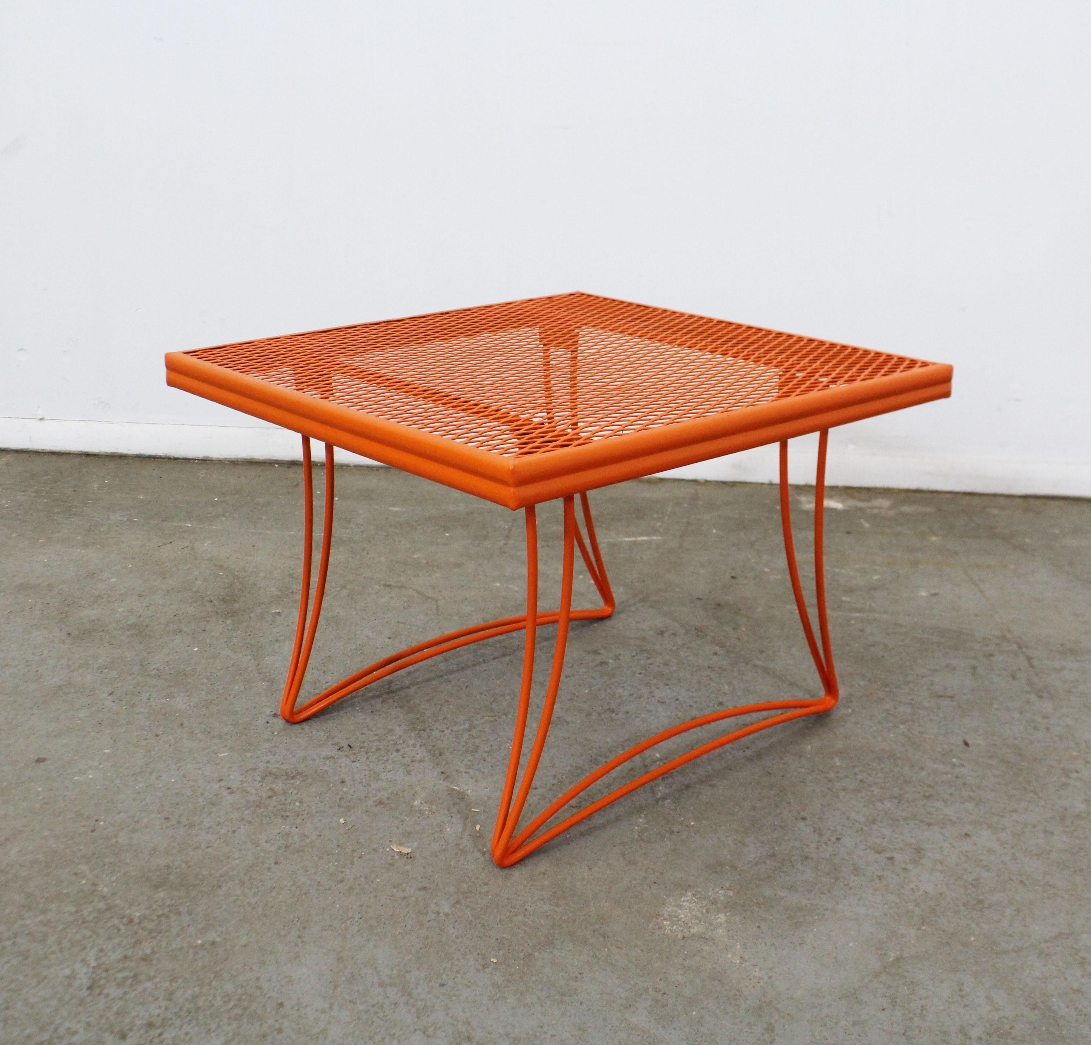 What a find. Offered is a midcentury outdoor/patio square end table (model 1521) made by Homecrest Bottemiller, circa 1968. This piece is made of welded steel and features gracefully styled legs and a mesh top. It is in good condition considering