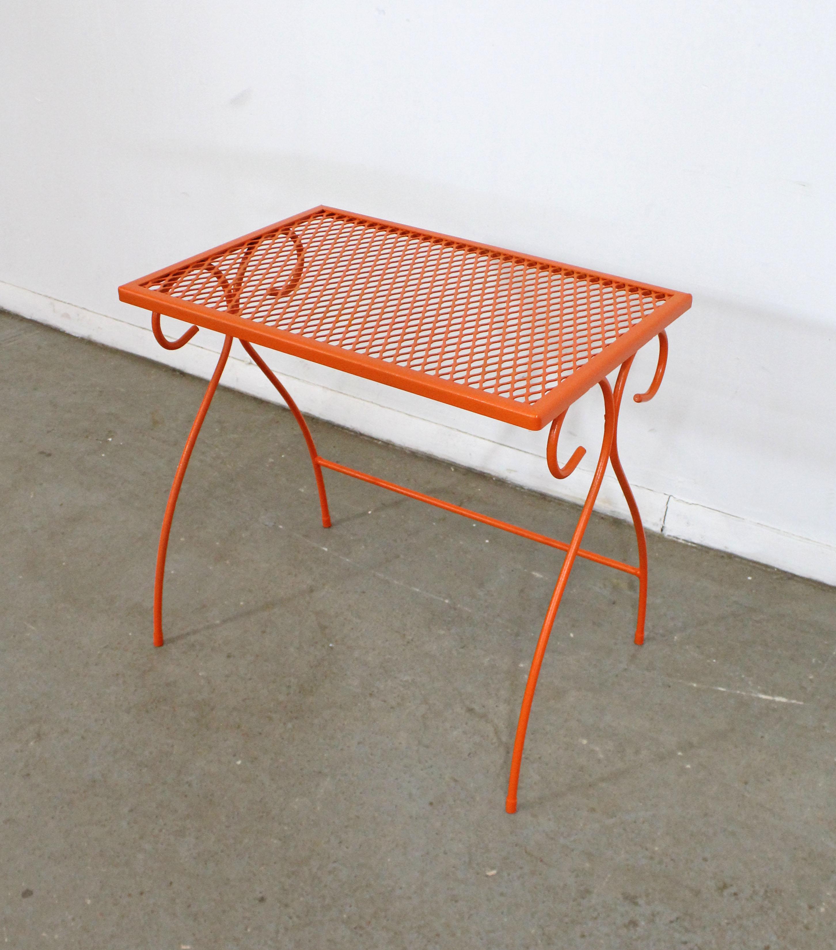 What a find. Offered is a rare midcentury outdoor/patio side table made by Homecrest Bottemiller, circa 1968. Perfect for outdoor lounging! This piece is made of welded steel and features gracefully styled legs and a mesh top. It is in good