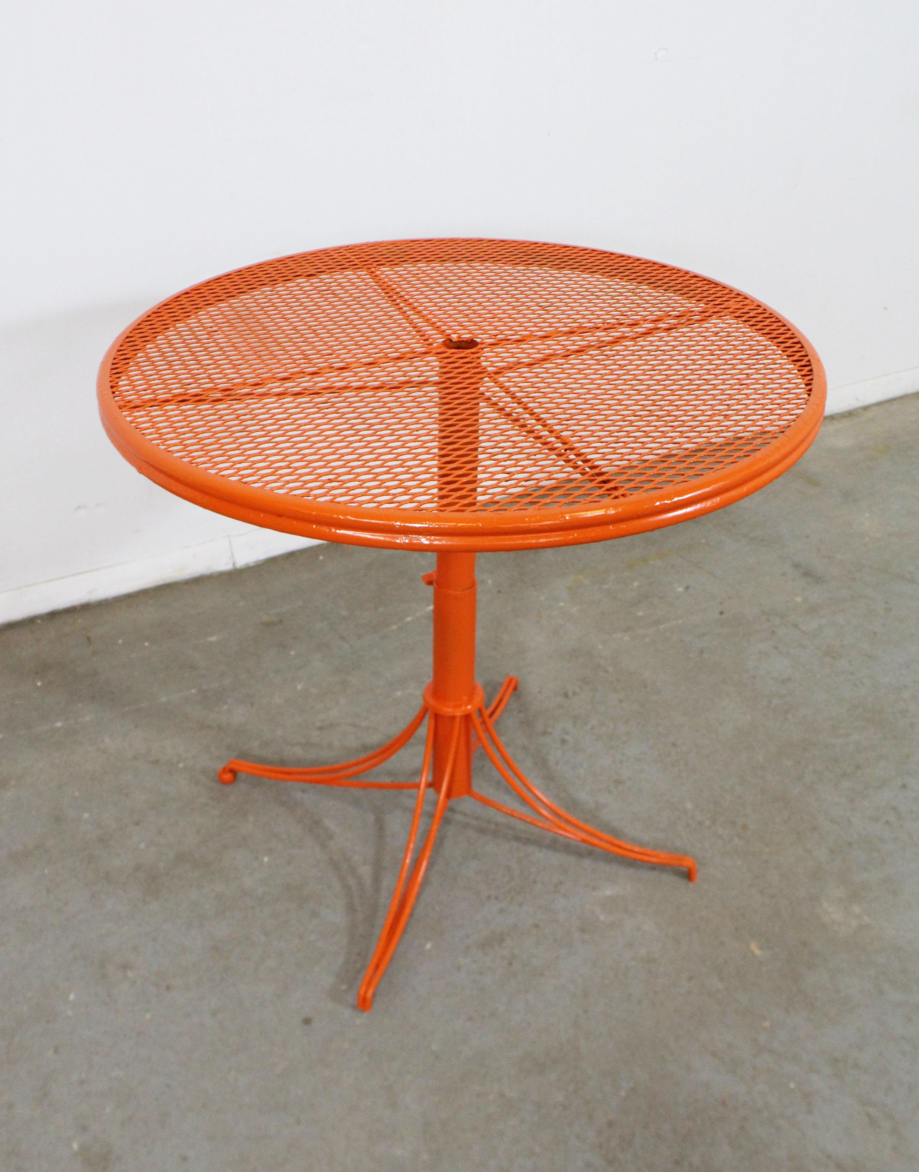 What a find. Offered is a rare Mid-Century Modern outdoor/patio bistro table made by Homecrest Bottemiller, circa 1968. Perfect for outdoor lounging! This piece is made of welded steel and features gracefully styled legs and a mesh top. It is in