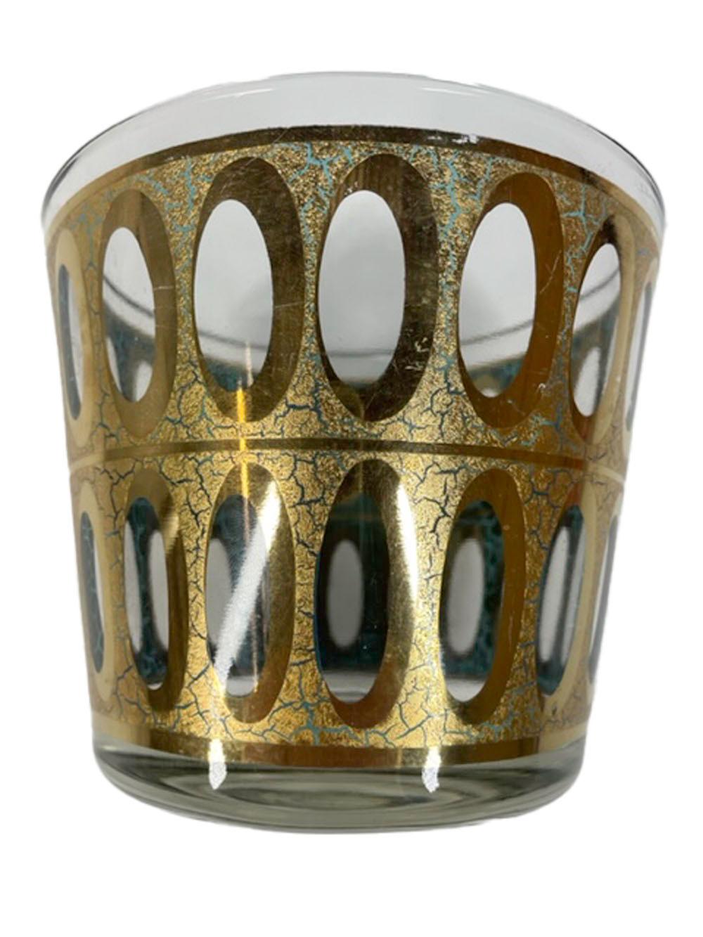 Ice bowl made by Culver, LTD. in the 'Pisa' pattern having crackled 22k gold over translucent green enamel with rows of clear ovals. On the exterior the green is exposed through the crackled gold surface, while the interior shows brighter green