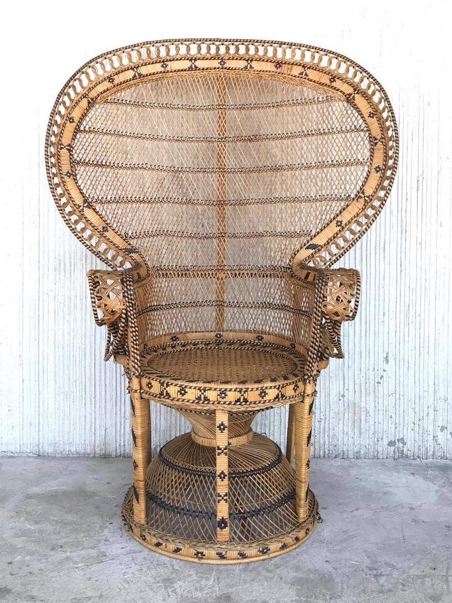 Iconic Emmanuelle wicker and rattan midcentury peacock chair. This chair is a statement piece and in mint condition. It has no broken, no brittle or repaired pieces. Displays well and is very strong. The color is awesome and would work in any