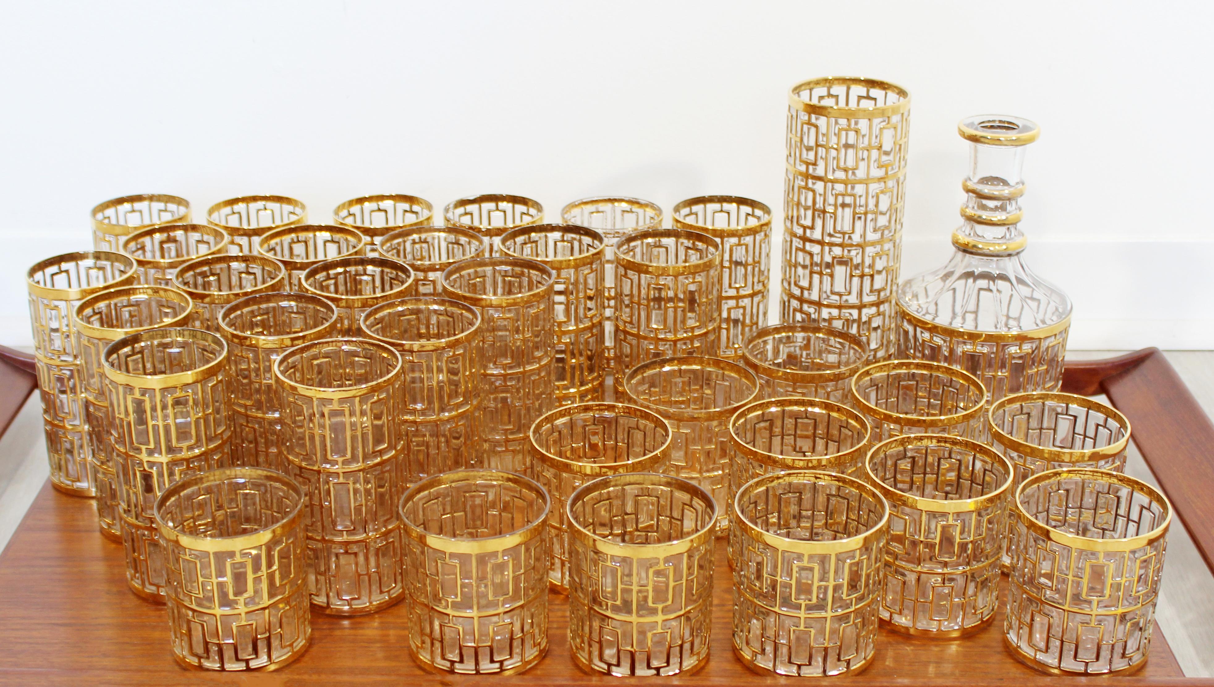 For your consideration is an incredible, complete set of 22-karat gold Shoji glasses, including twenty highball glasses, twelve glasses, one decanter with stopper and a tall cocktail mixer, circa 1960s. In very good condition. The dimensions of the