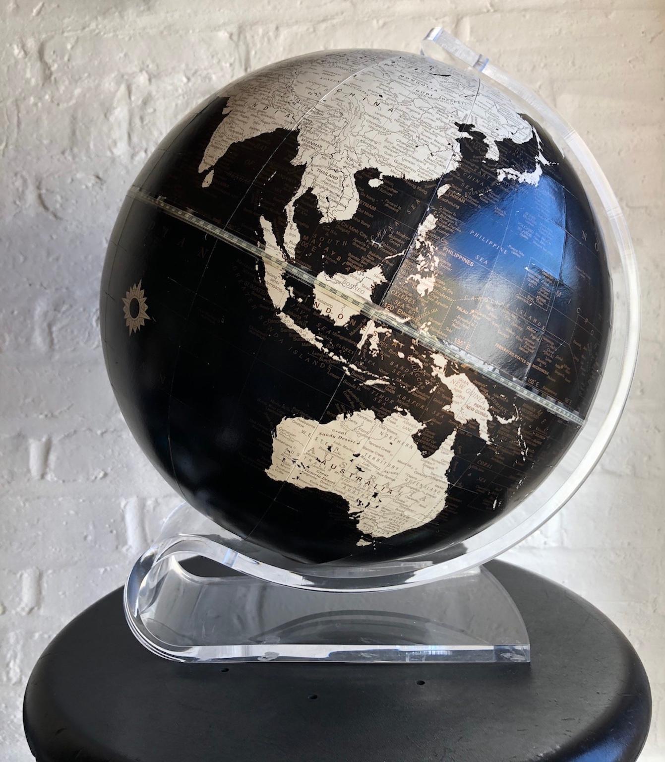 Mid-Century Modern black and white world globe with Lucite stand by George F. Cram, 1970s

‘Imperial Globe’ globe on Lucite stand by George F Cram Company. Unique chic black and white with hint of gold accents.

There is some minor wear and tear