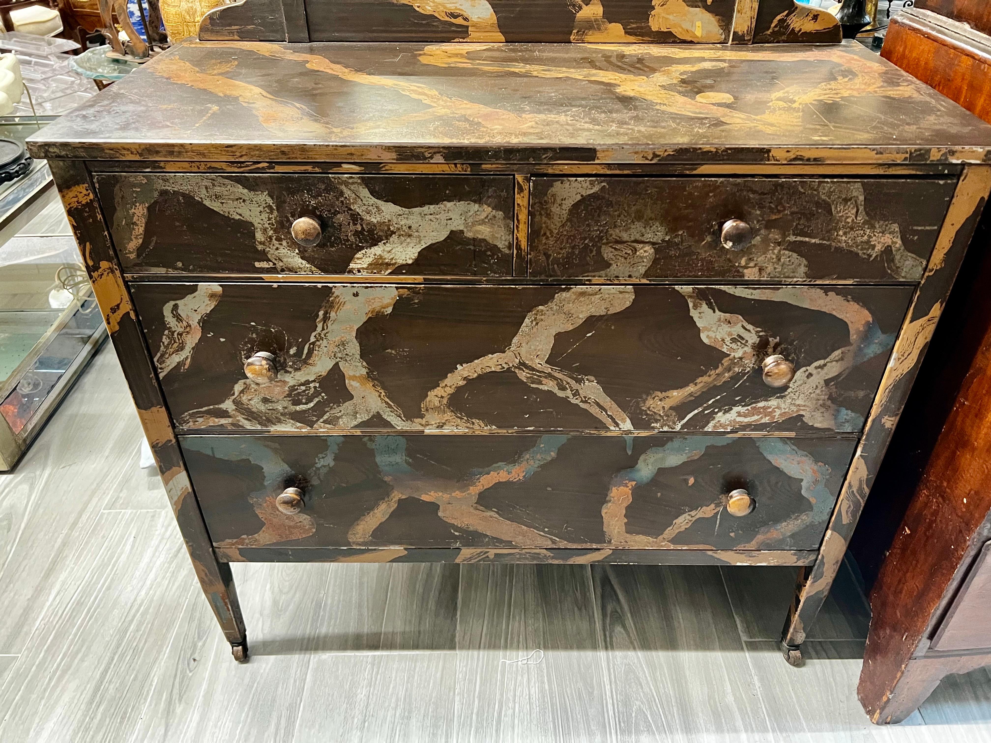 Iconic yet unusual metal hand painted dresser with cheval mirror attached. The distressed color scheme makes this case piece look like a work of art.
Sturdy and a center point in any room. The mirror only dimensions are 26