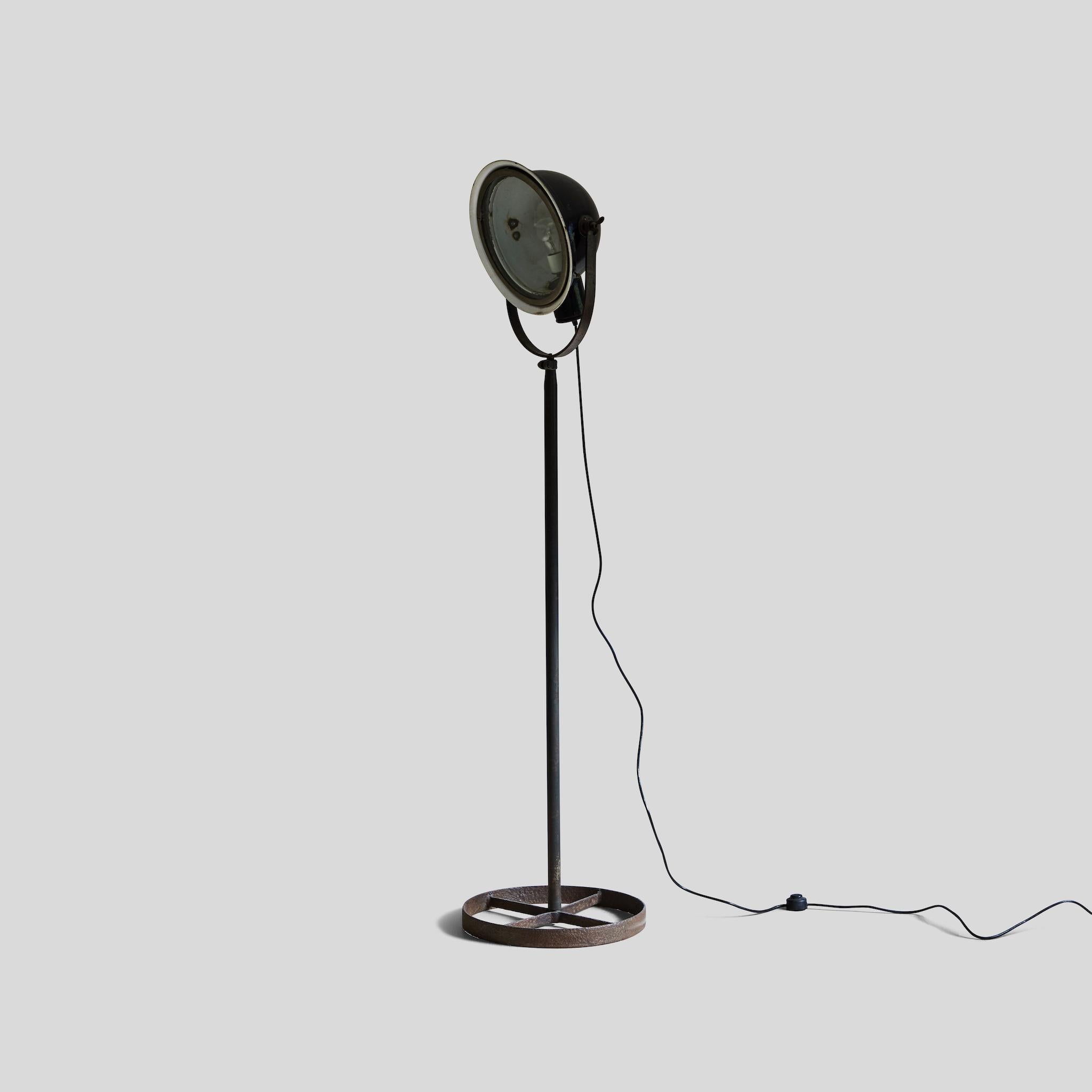 Mid-century modern industrial metal floor lamp from England. 

This piece is a great example of mid century English Industrial lighting. The lamp is wired for use in the US standard outlets.

This piece measures 16.5