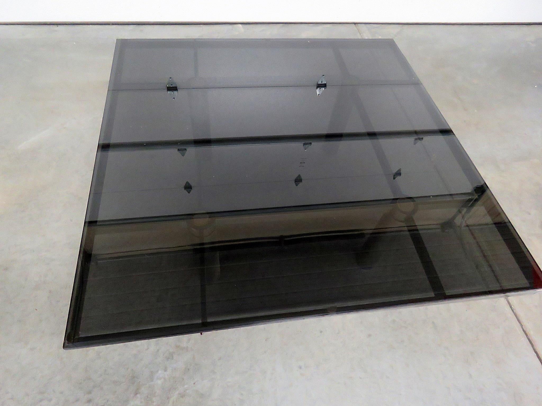 Mid-Century Modern Industrial style steel based coffee table with a smoked glass top.
