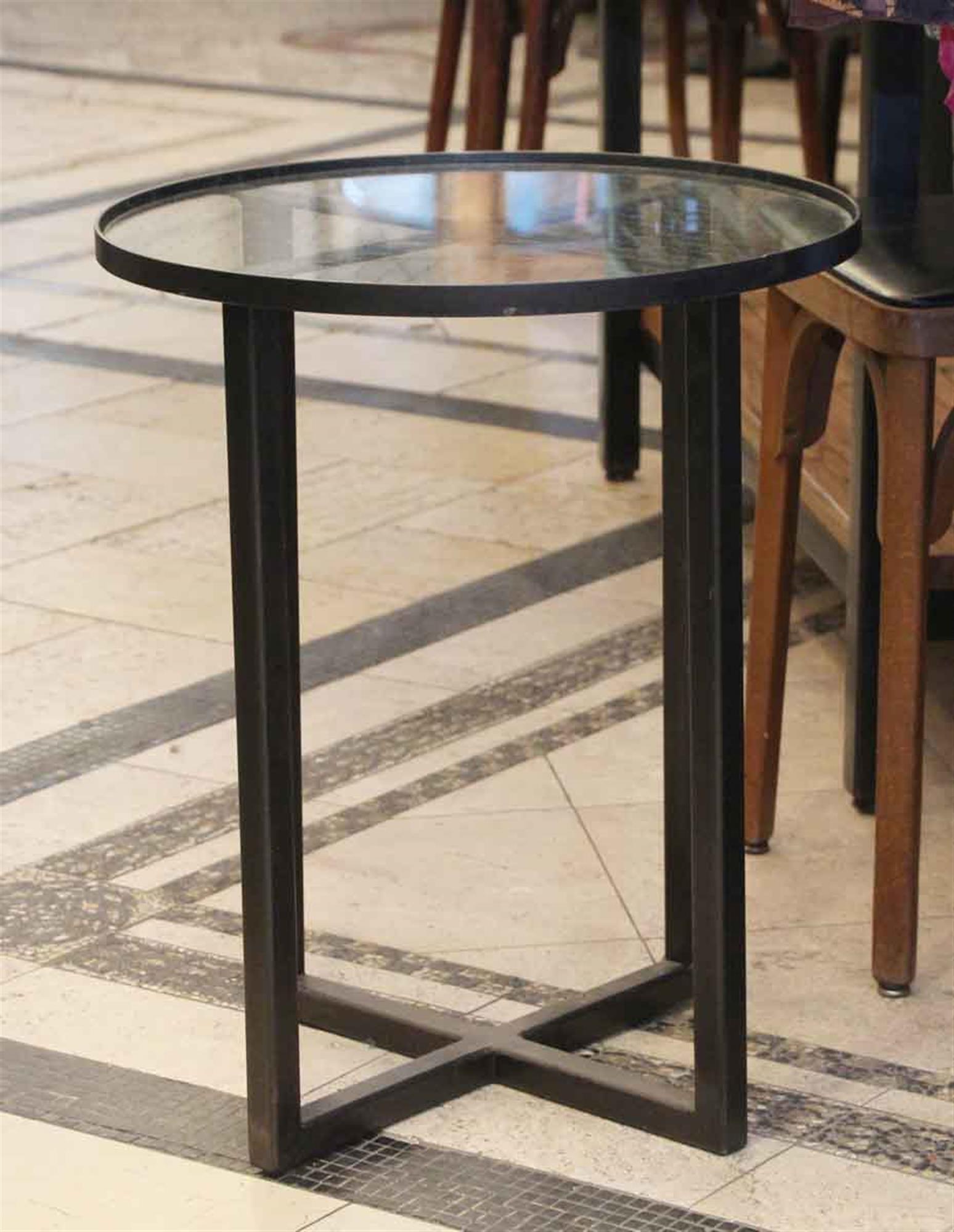 Round top chicken wire glass table with a black finished steel frame. Done in a Mid-Century Modern / Industrial style. Small quantity available at time of posting. Custom sizes available. This can be seen at our 5 East 16th St location on Union