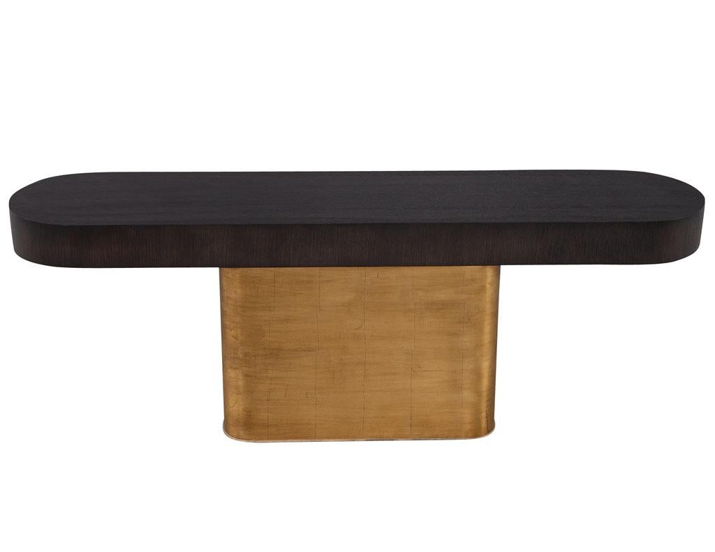 Mid-Century Modern inspired console table with pull out ottoman stools. In the manner of iconic mid-century modern designer Milo Baughman. Unique one of a kind console composed of curved rift cut oak woods in a charcoal brown finish. Completed with