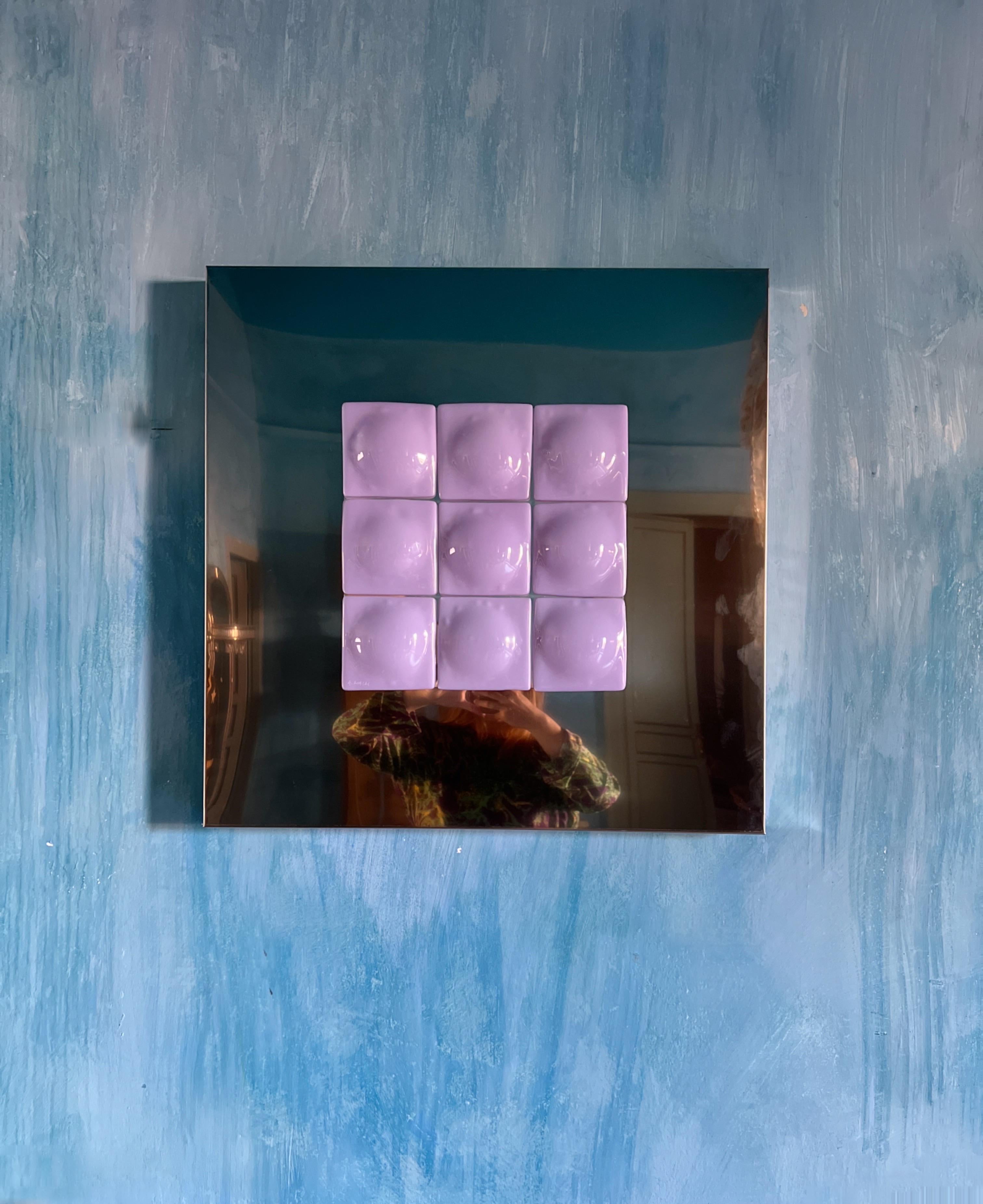 Mirror Illusion
A stunning art piece designed by Swedish artist Amanda Malm.

This captivating sculpture blends stainless steel and fused glass in a radiant violet tone. Nine nearly symmetrical square glass pieces, each softened by a round, feminine
