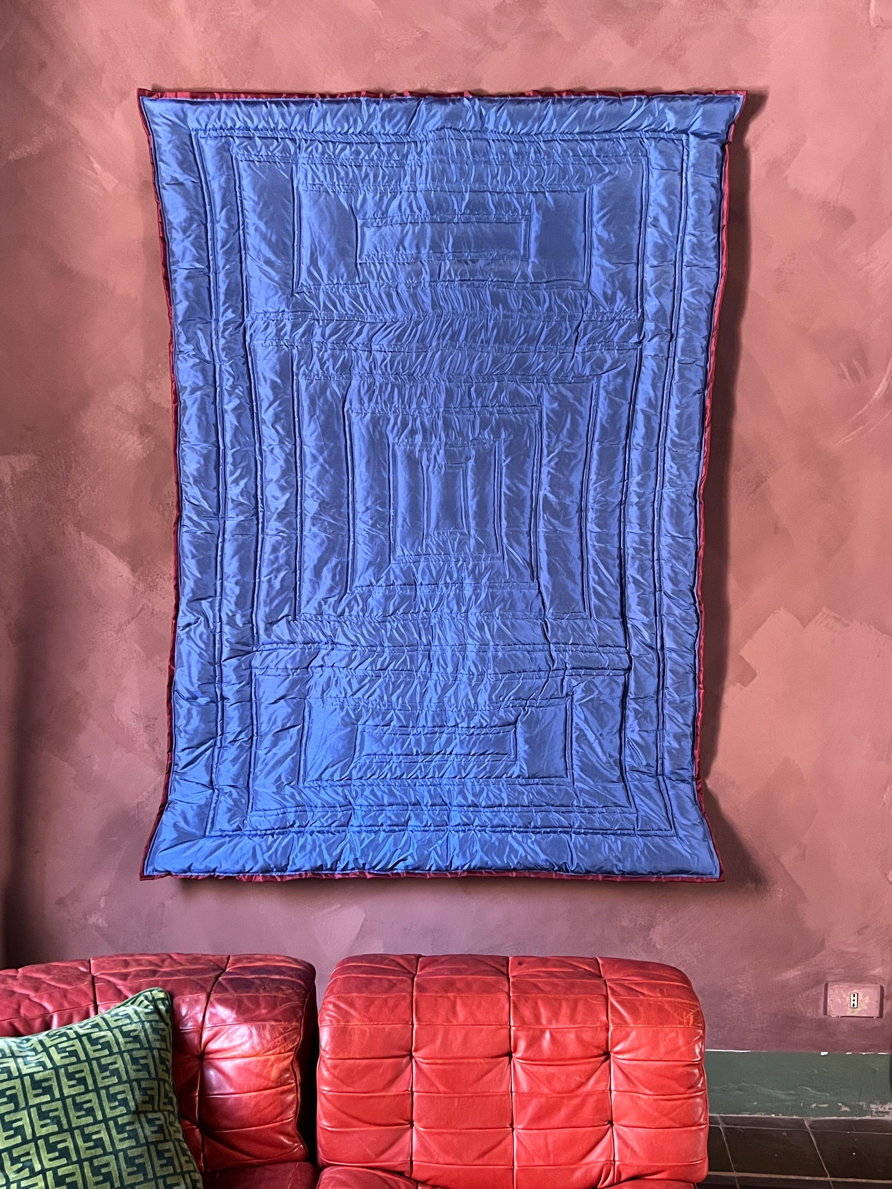 This wall mounted textile sculpture by Swedish artist Amanda Malm is crafted from pure raw silk and brings a soft tactile presence to any room. The deep ocean blue color adds a sense of calm and depth while the natural silk texture gives warmth and