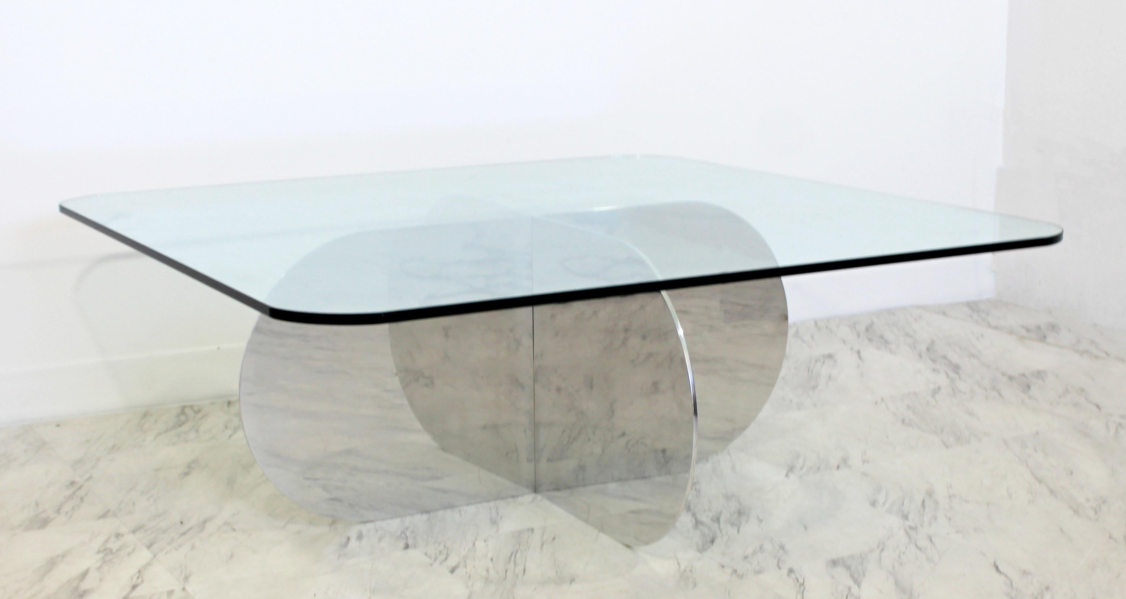 For your consideration is a stunning coffee table, with a glass top on a chrome base of thin, interlocking pieces, circa the 1970s. Attributed to Brueton or Pace. In excellent condition. The dimensions are 42