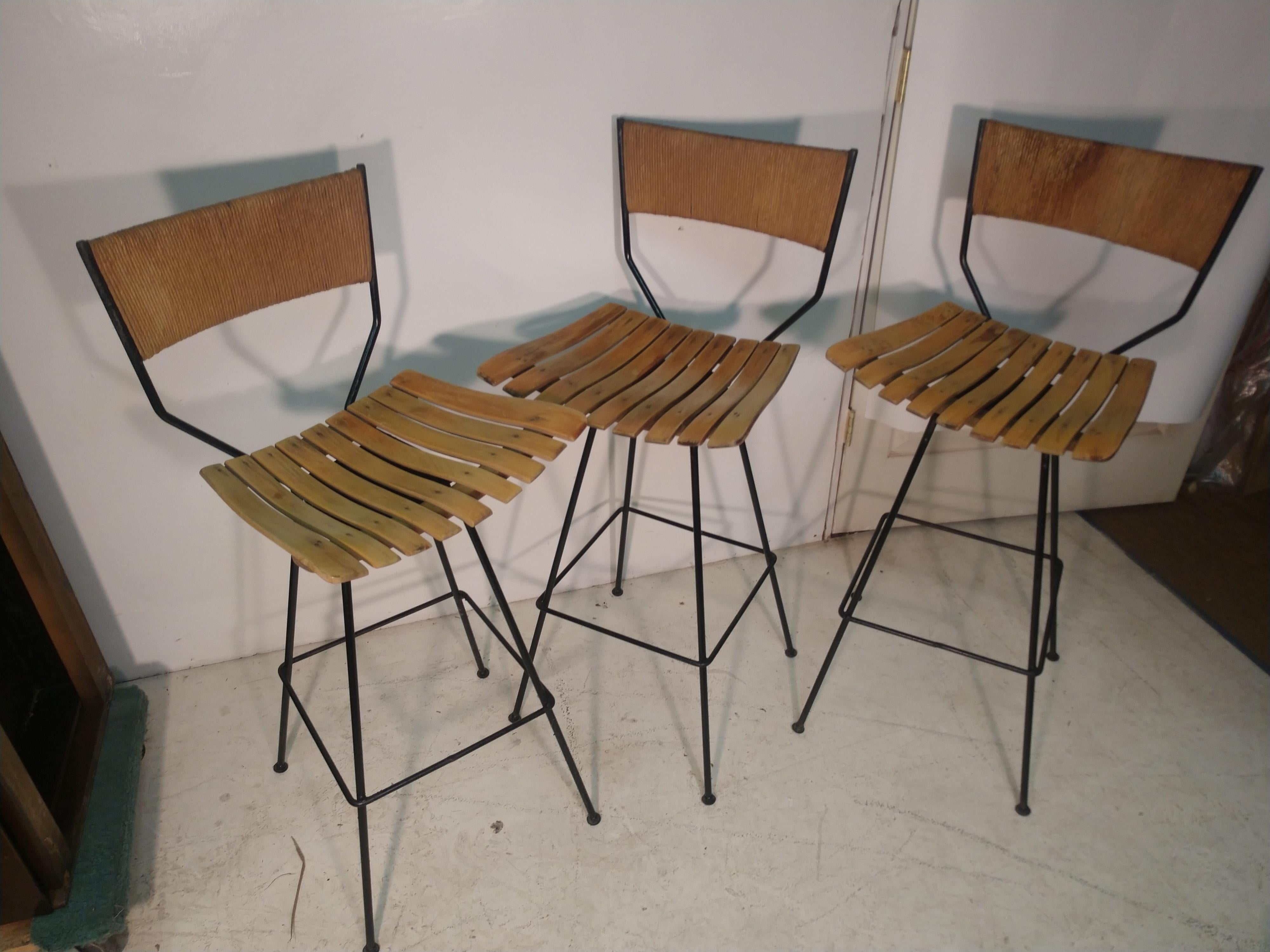 Welded Pair of Mid Century Modern Iron with Maple and Raffia Bar Stools Arthur Umanoff For Sale