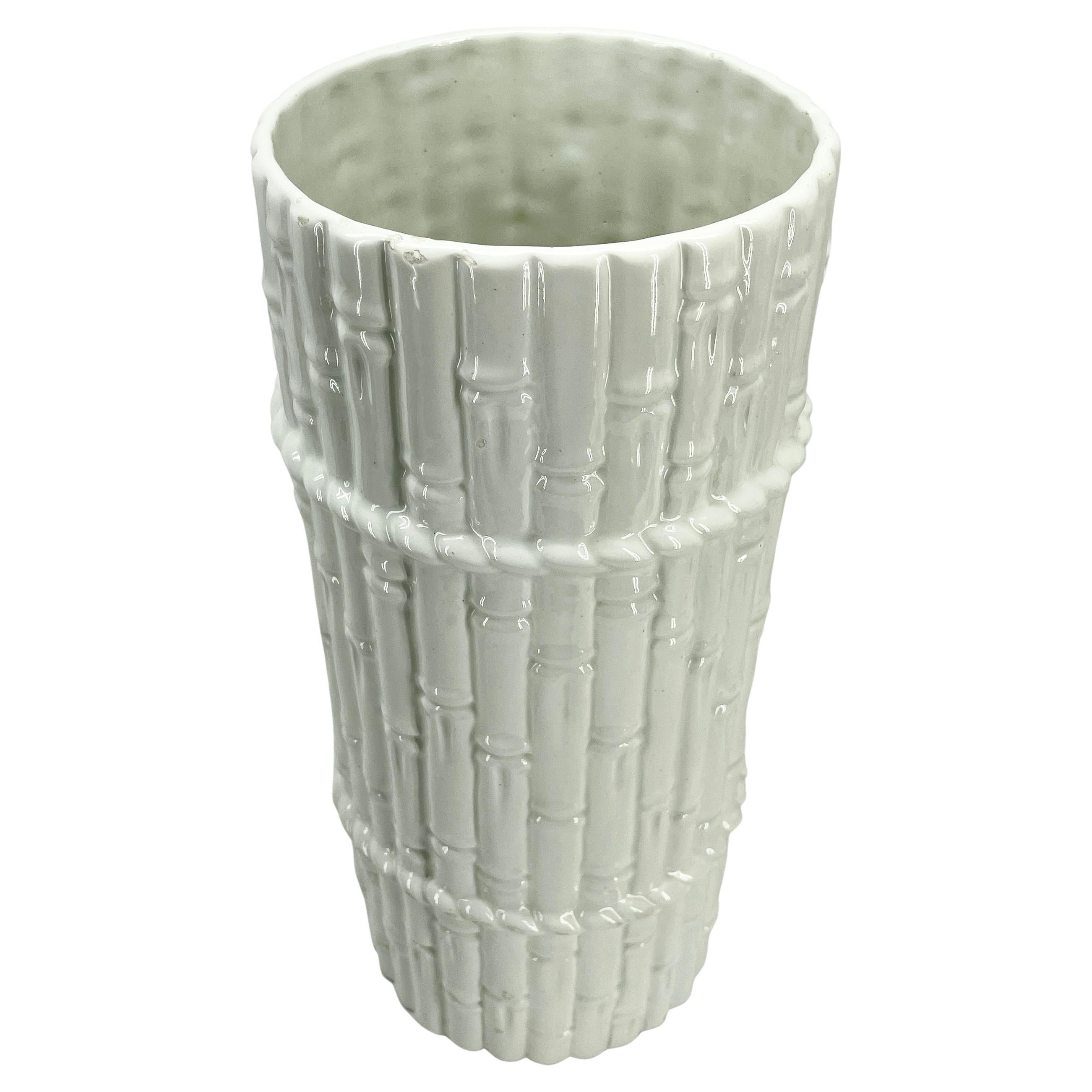 Vintage Isco faux bamboo umbrella stand, made in Spain. 
White and classic, this faux bamboo ceramic umbrella stand is an iconic Mid-Century Modern design. The umbrella stand is a classic example of modern homes in the late 1960's and 1970's.