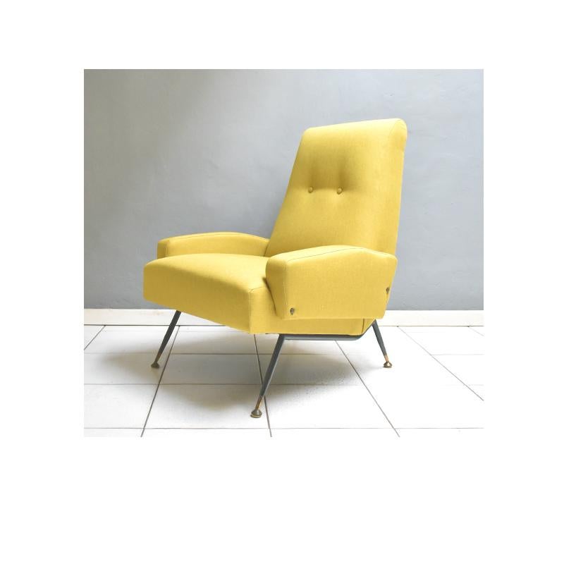 1960s vintage armchair, Italian manufacture. 
Brass feet, new ocher fabric upholstery and iron legs.
Very good condition with new fabric upholstery.
    