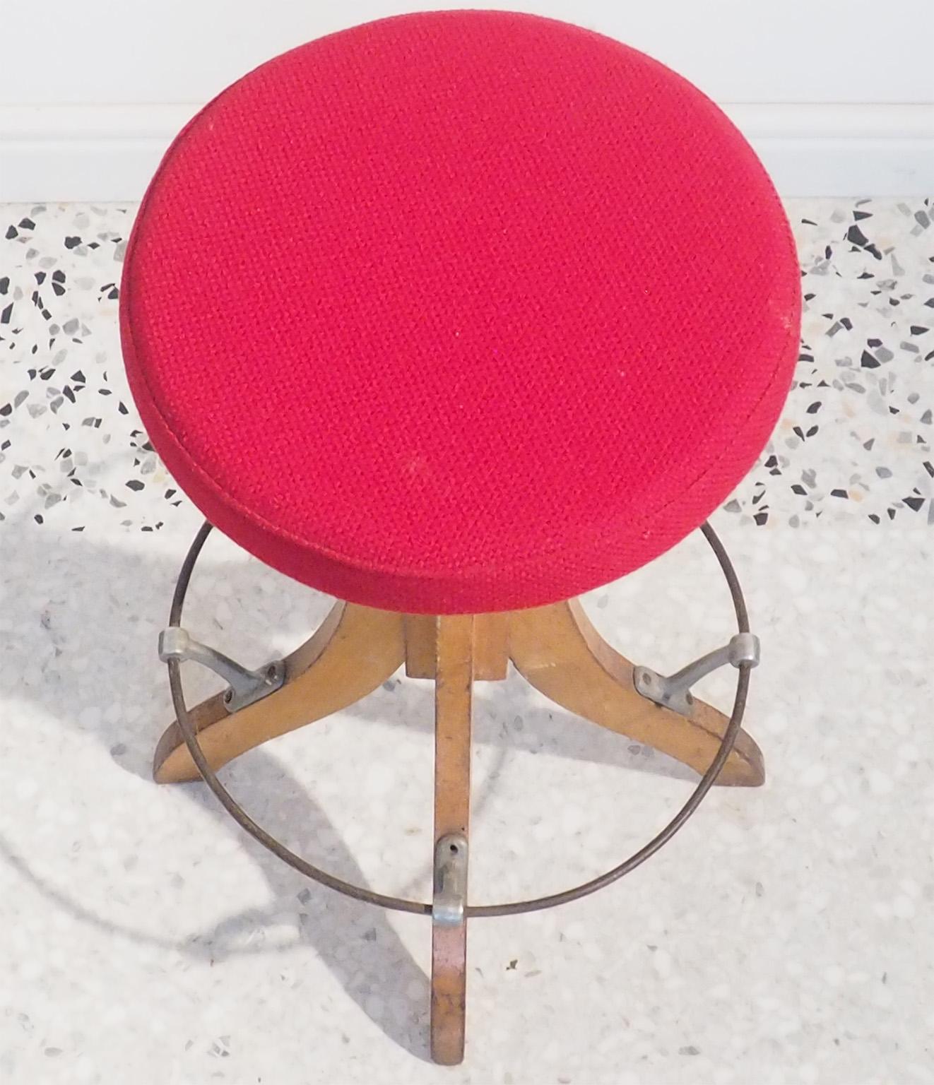 Italian stool with red Kvadrat fabric on the top,
The seat is adjustable
Wood legs with metal support for feet,
Height adjustable: 60 - 70 cm.