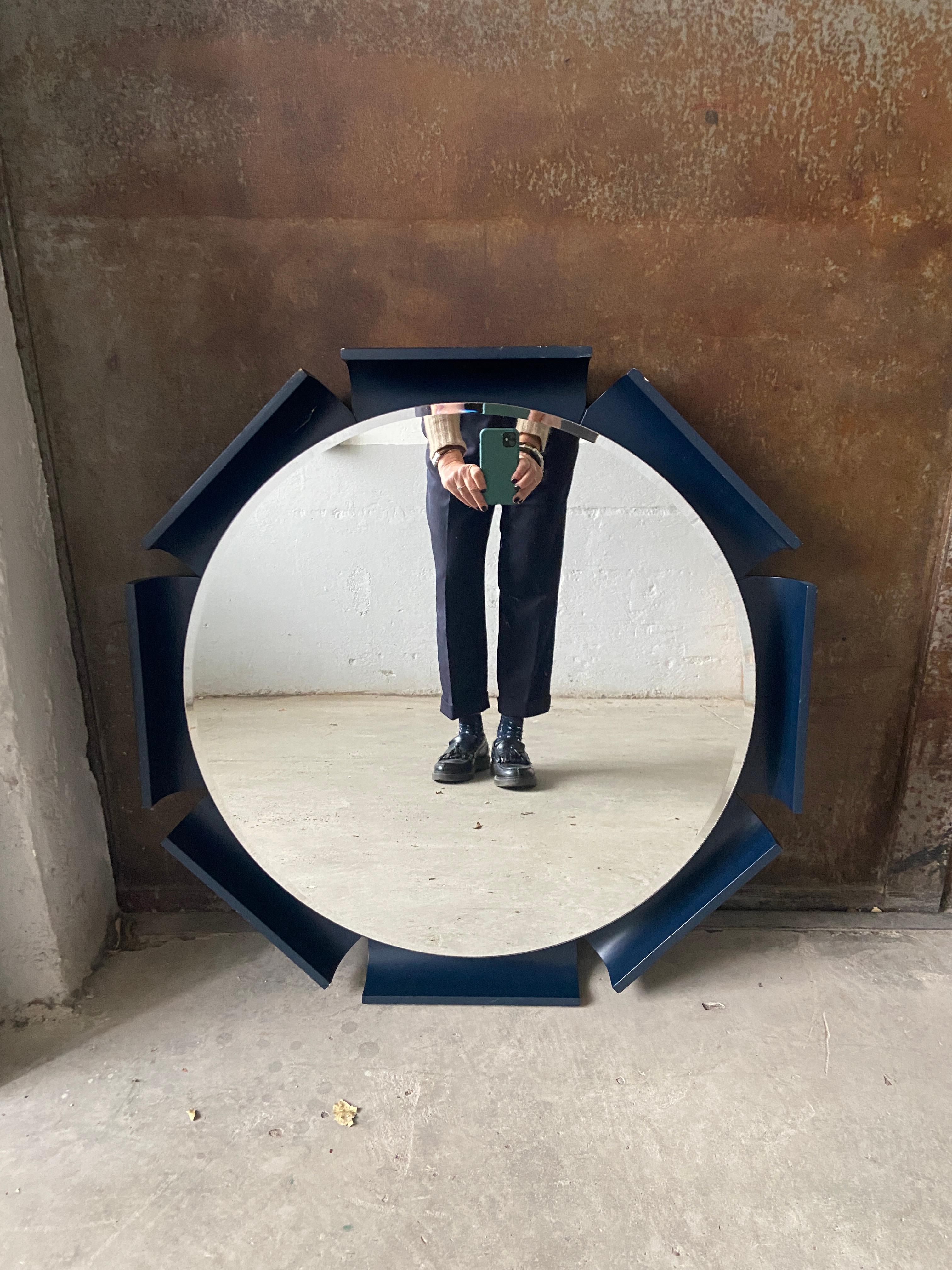 Mid-Century Modern Italian back lit round beveled wall mirror with deep blue lacquered wooden frame. 
The diameter of the mirror is cm.60. the whole mirror has a diameter of cm.70.
 