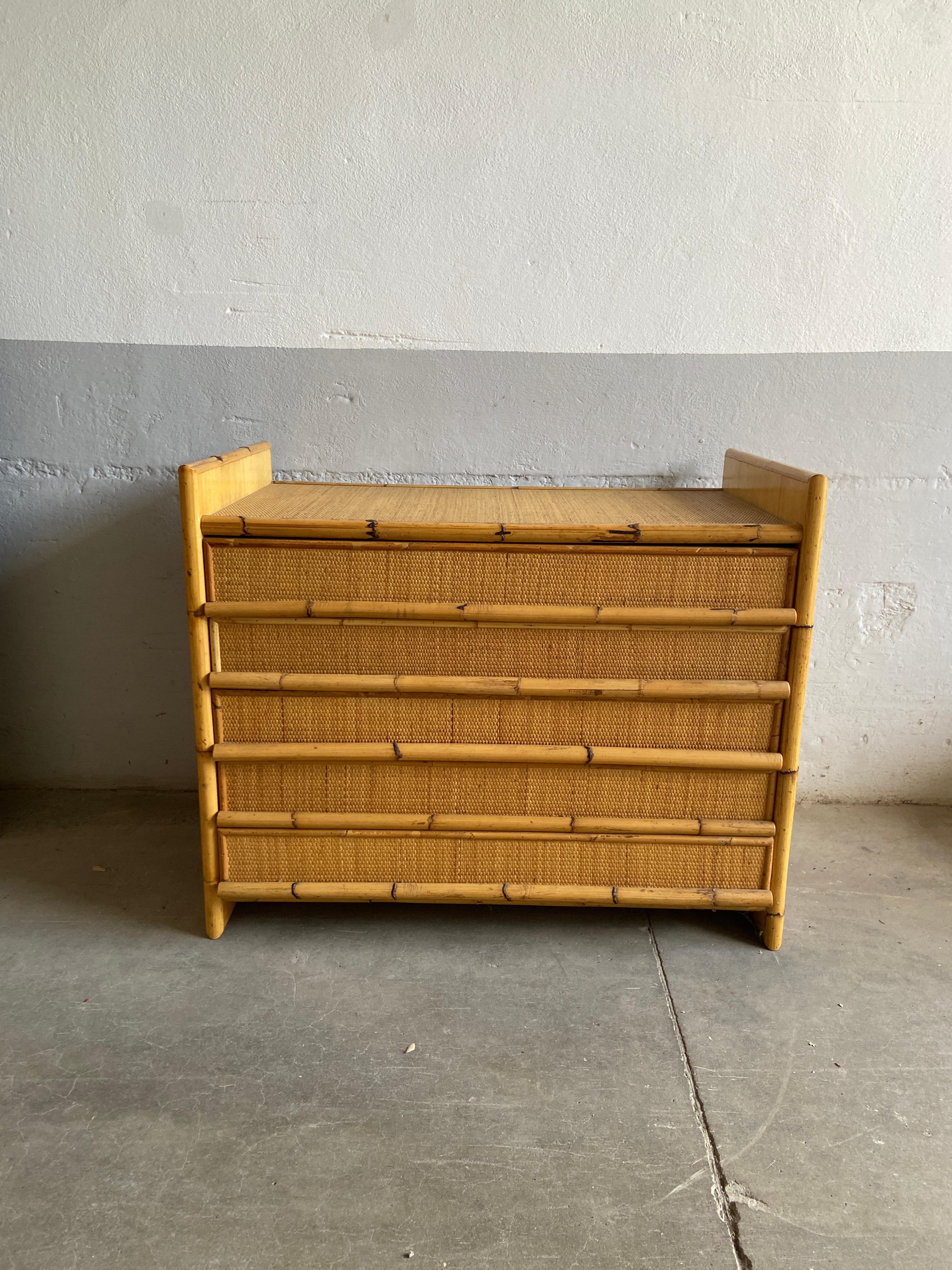 Mid-Century Modern Italian Bamboo and Rattan Chest of drawers.
Each of the 5 drawers has a full-length bamboo handle that gives a special, decorative look to the cabinet.
This piece has a really stunning patina due to age and use.
