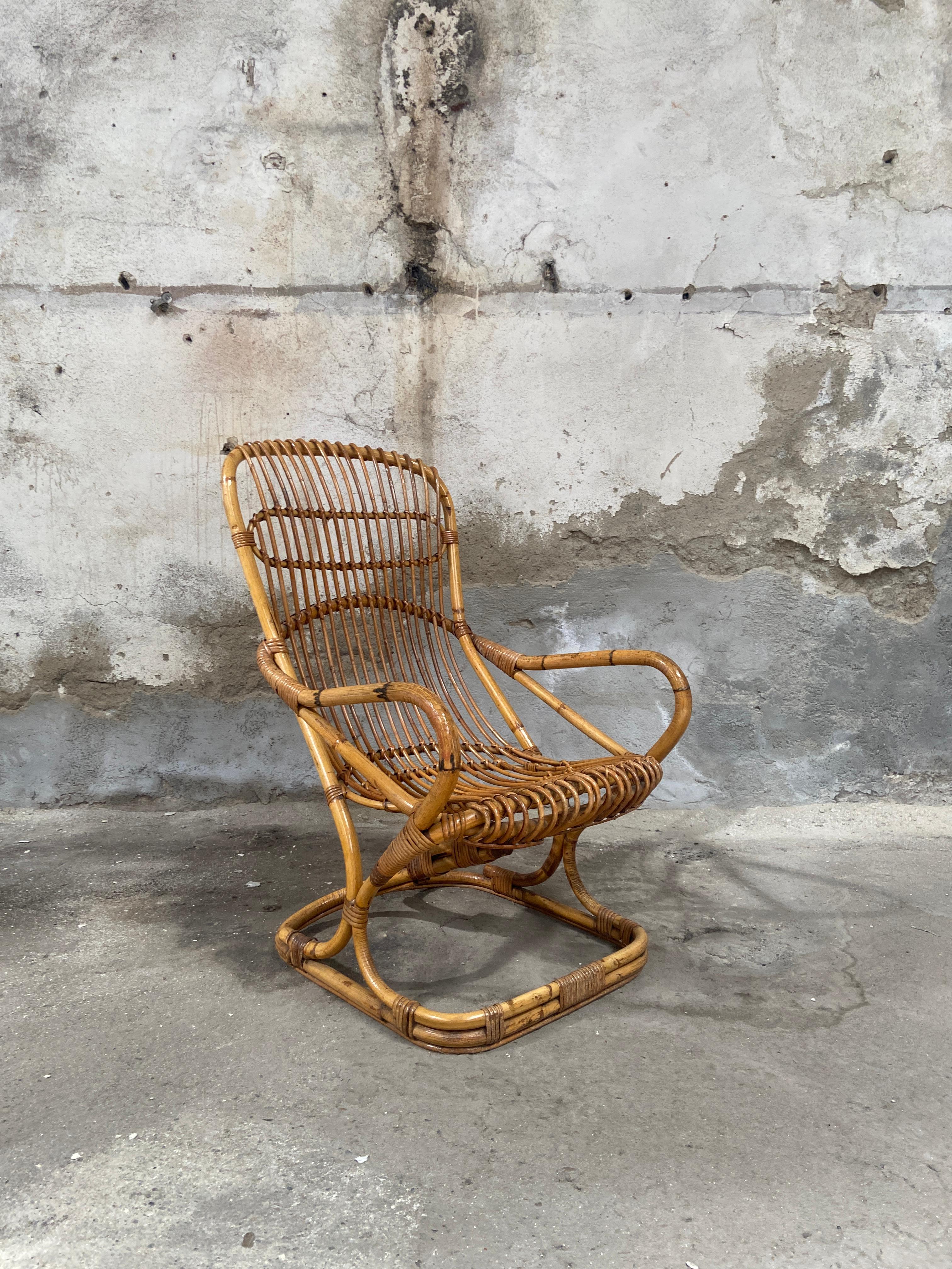 Mid-Century Modern Italian Rattan Armchair by Tito Agnoli for Bonacina.
This item has a wonderful patina due tu age and use.
In the seat and in the back as well a piece of rattan is missing but it can be replaced and restored. Cost on request.