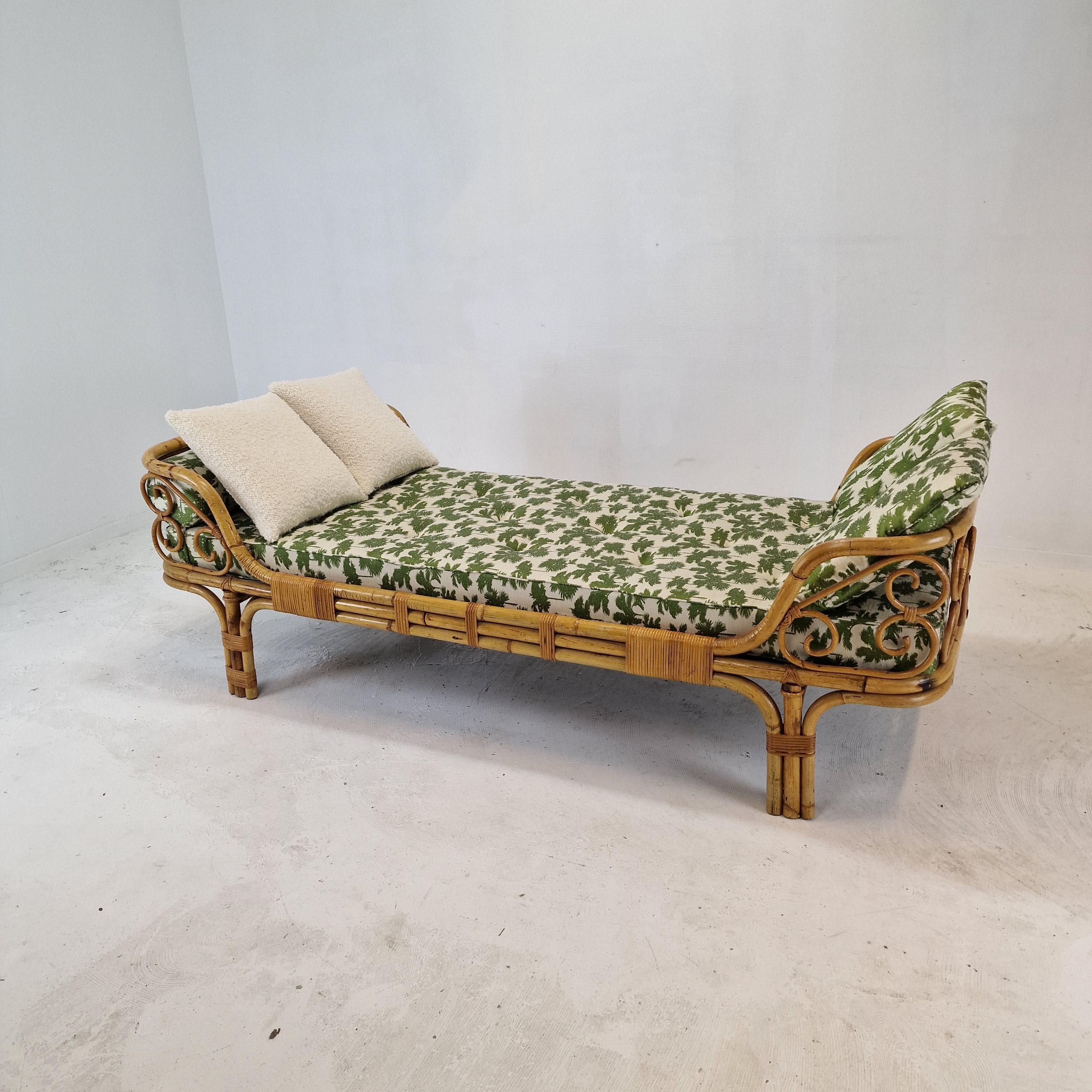 Iconic bamboo daybed, designed and manufactured in Italy in the 1960s. 

Newly made cushions, bolster and mattress just upholstered with stunning Dedar Italy fabric. 

This daybed is included the bolster and cushions. 
Original bamboo structure
