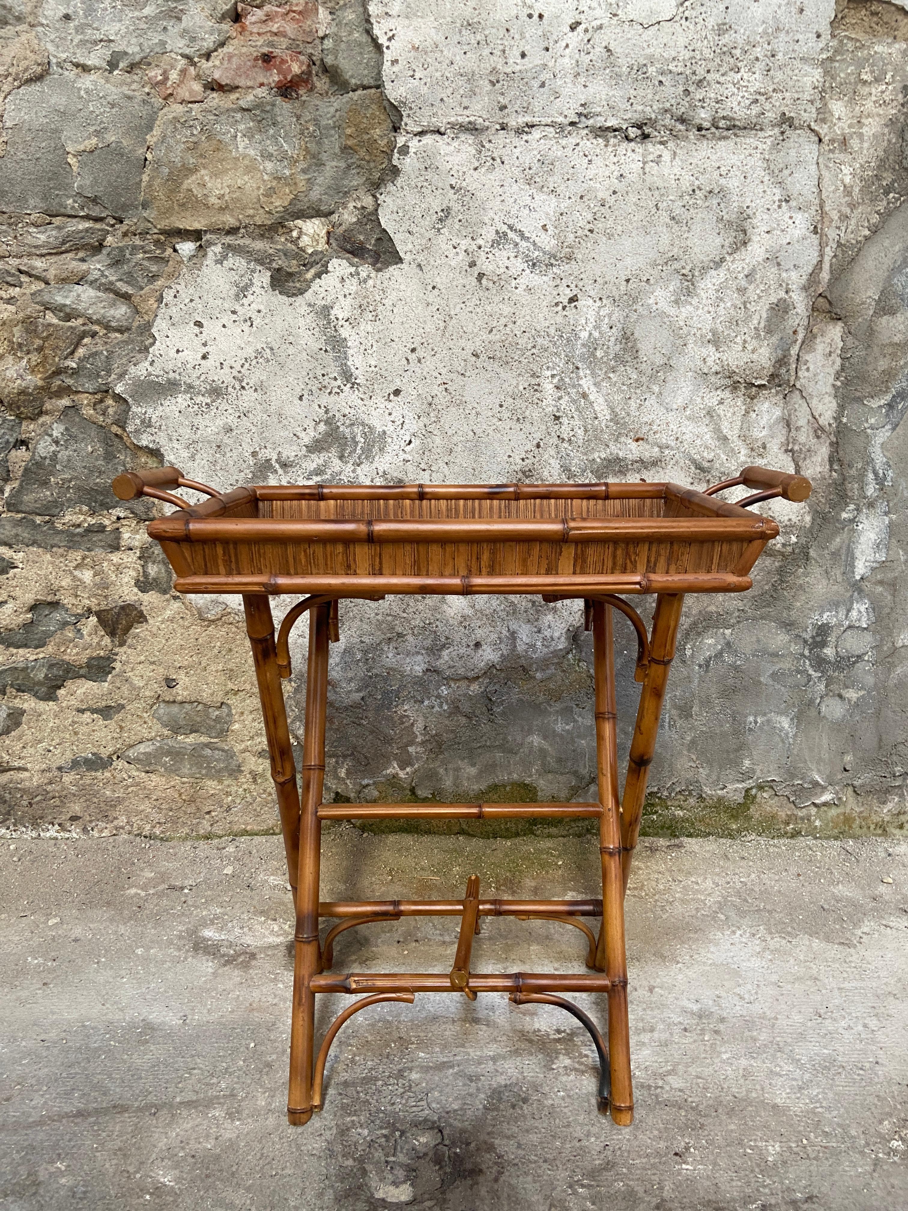 Mid-Century Modern Italian bamboo folding tray table with handles. 
Measures when folded cm.16 x 80 x H 55.