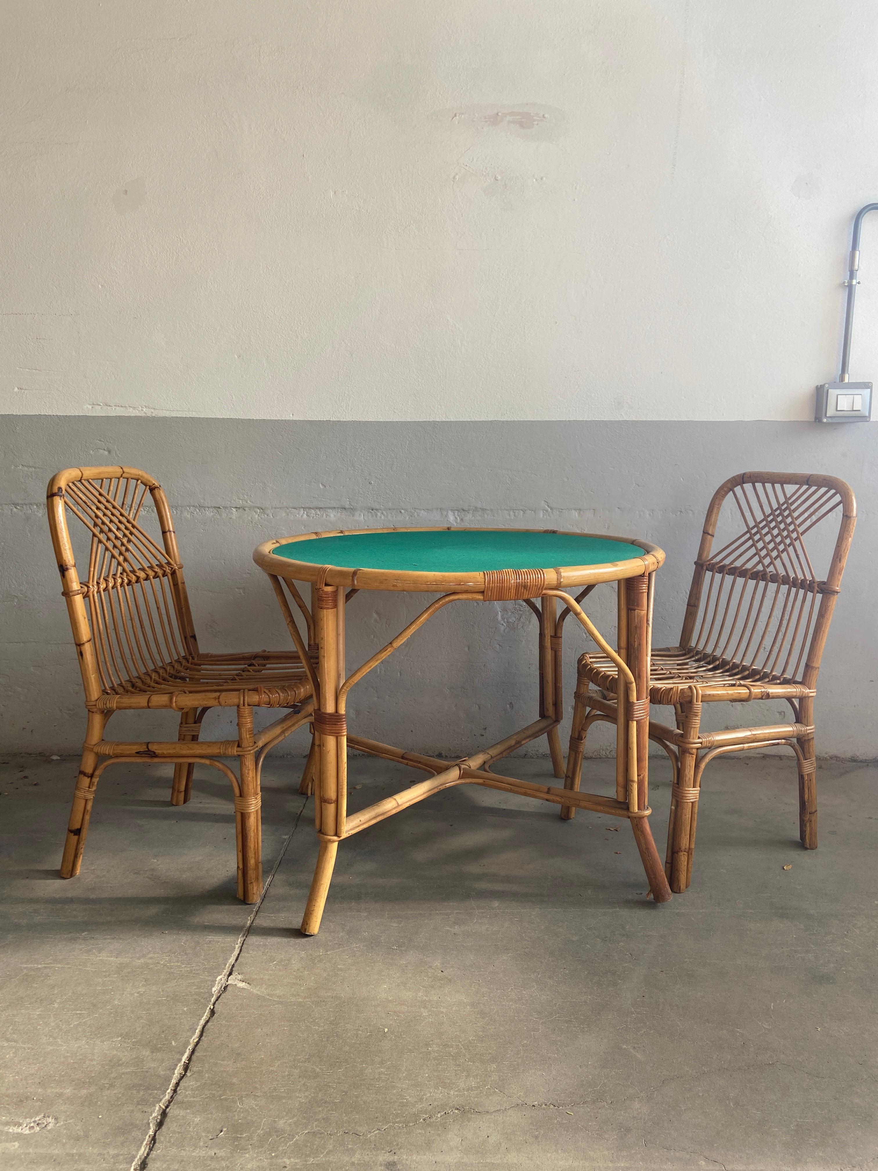 Mid-Century Modern Italian Bamboo game table set.
The Table top with green cloth is endorsable to become a normal dining table equipped with two bamboo seats.
The set presents some signs due to age and use; cost for restoration on