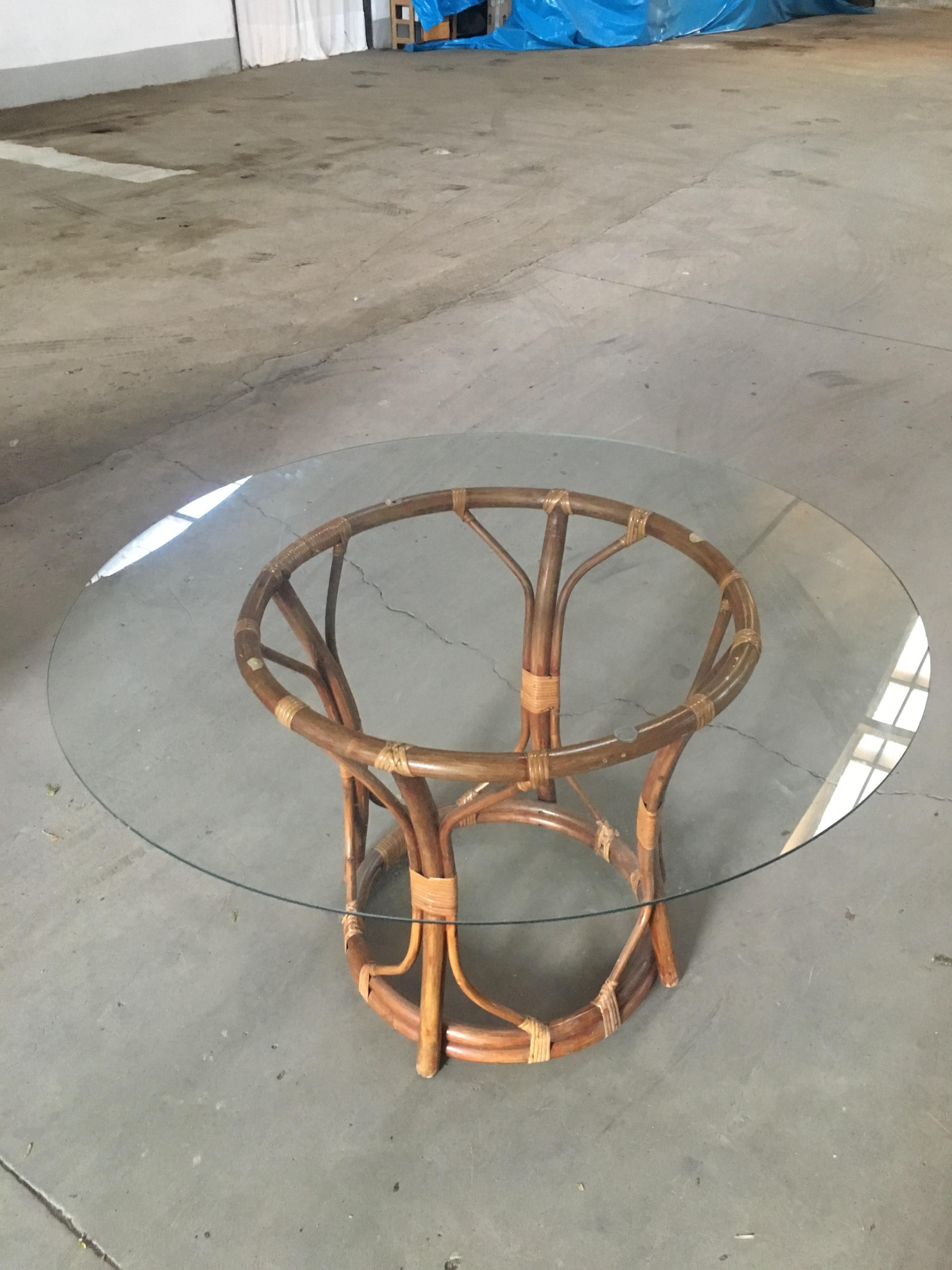 Mid-Century Modern Italian bamboo table with glass top,
The table could come with its 4 chairs as shown in the Photo. Price on demand.