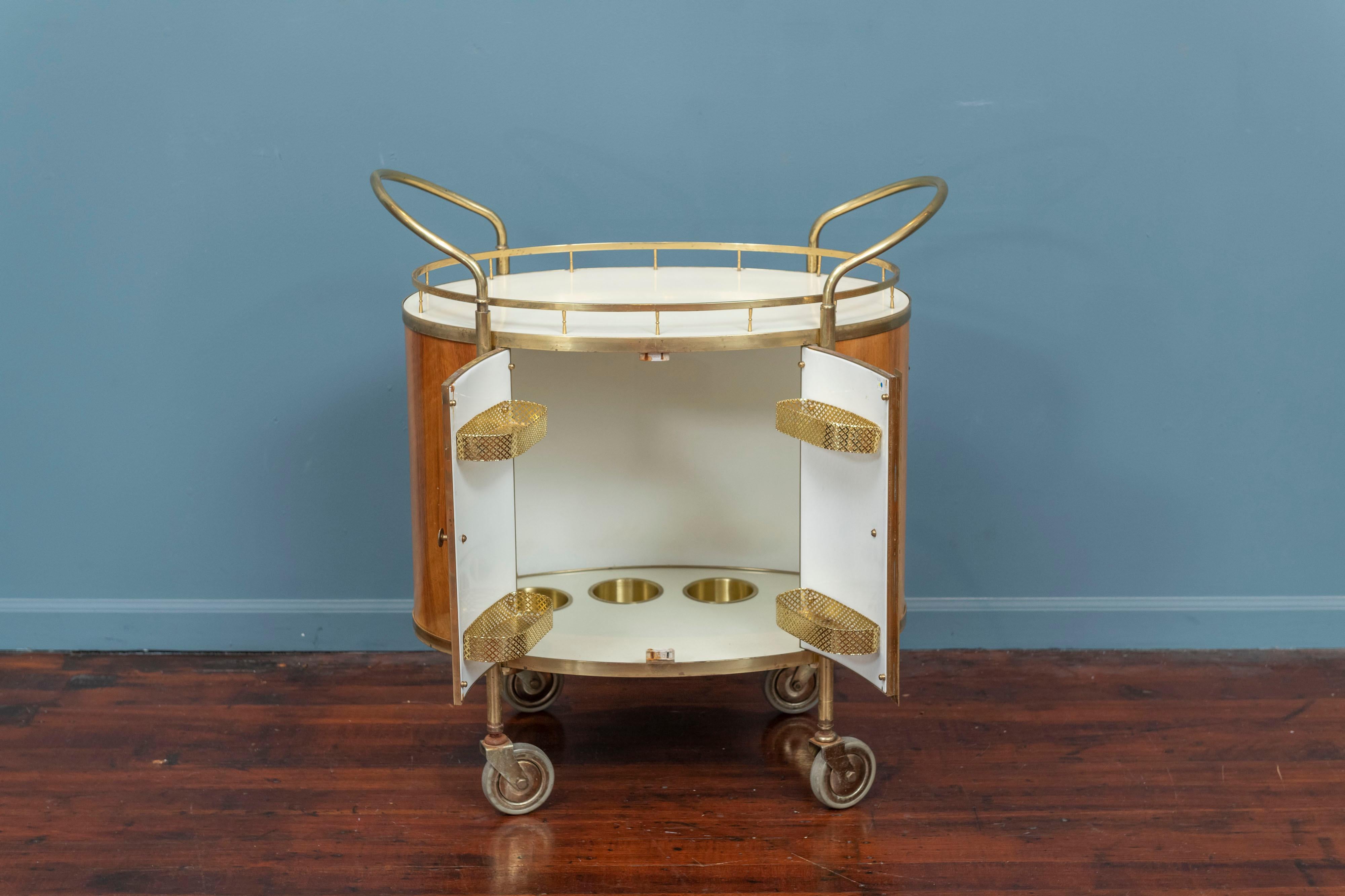 Mid-Century Modern Italian bar cart. Fun and clever designed bar cart or trolley with a removable serving tray, fitted interior and plenty of storage for bottles and serving accessories.