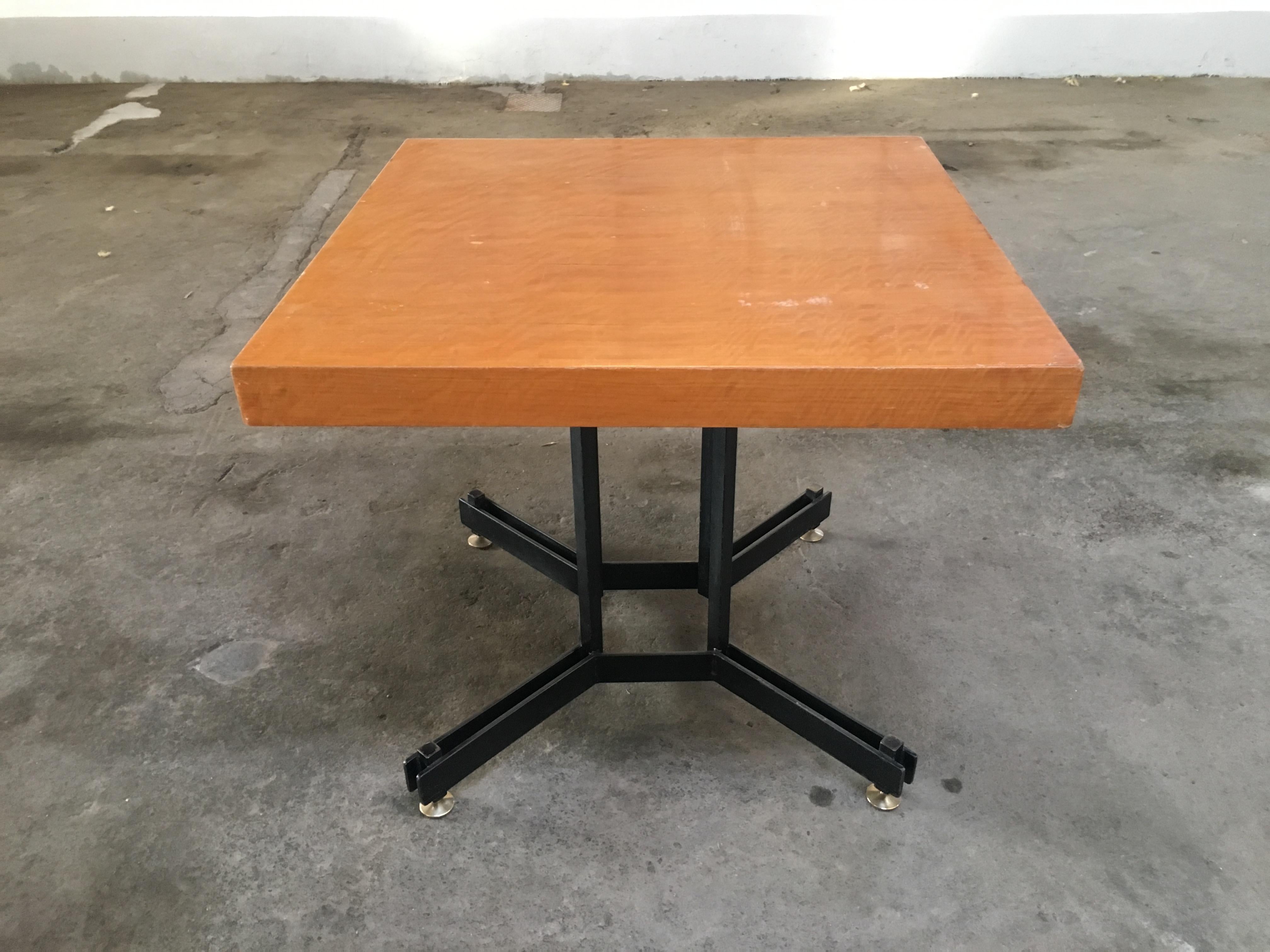 Mid-Century Modern Italian black iron base table with wood veneered top and brass feet, 1970s
The wooden top of the table shows some wear due to age and use but the table is in very good vintage condition.

 