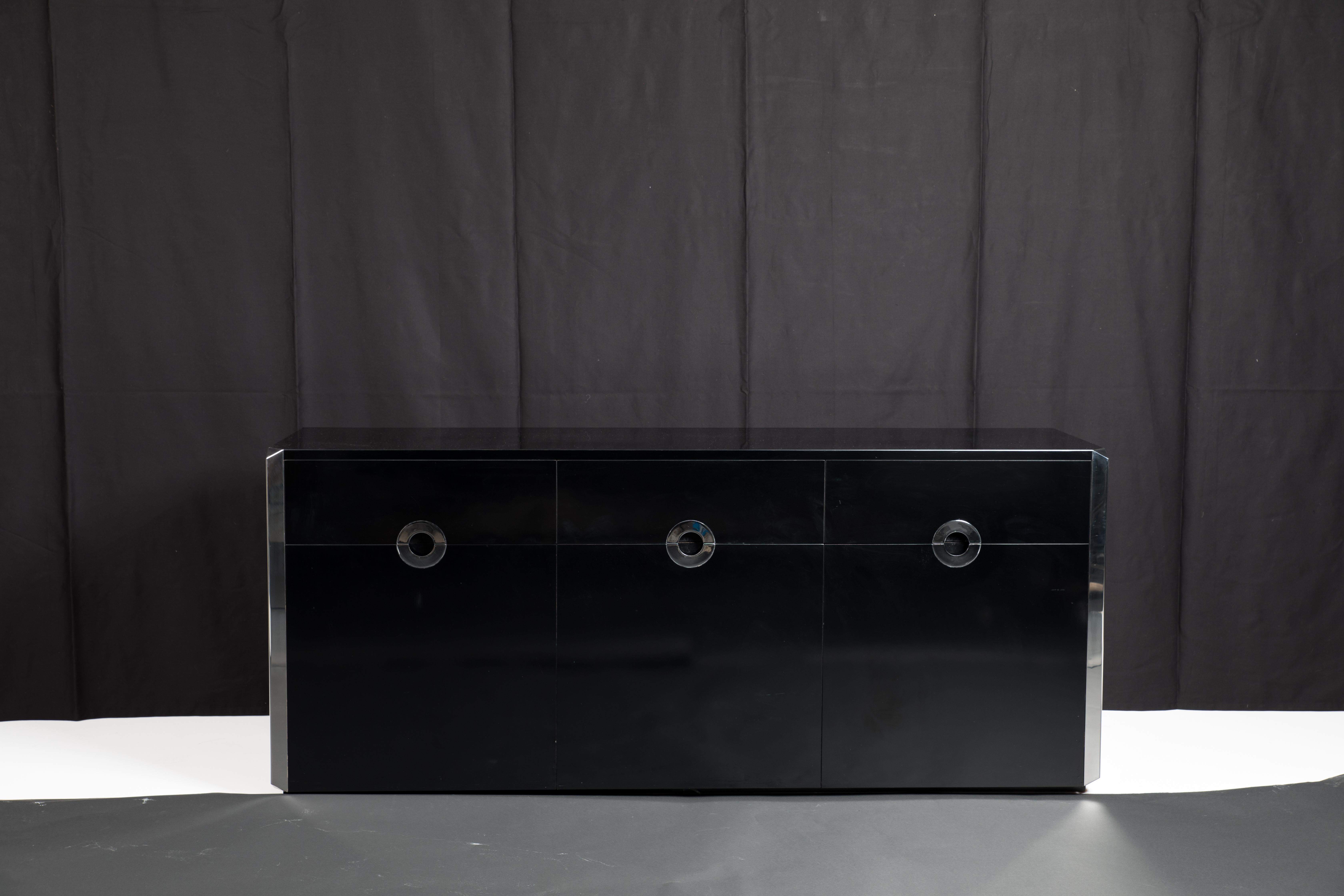Black laminate and chromed steel side board designed by Willy Rizzo and manufactured by Mario Sabot in Italy in 1972. Limited to a production of 2000 total, these were produced in white, black, and brown. Chromed steel edges and drawer pulls on