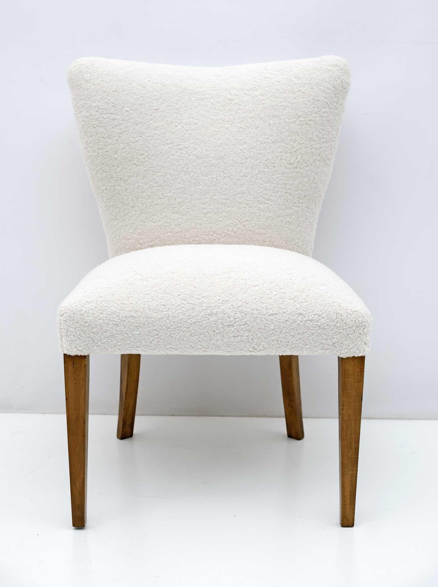 Mid-Century Modern small armchair, Italian production in the 1950s, completely restored and upholstered in Boucle fabric. It fits very well in a bedroom or living room.