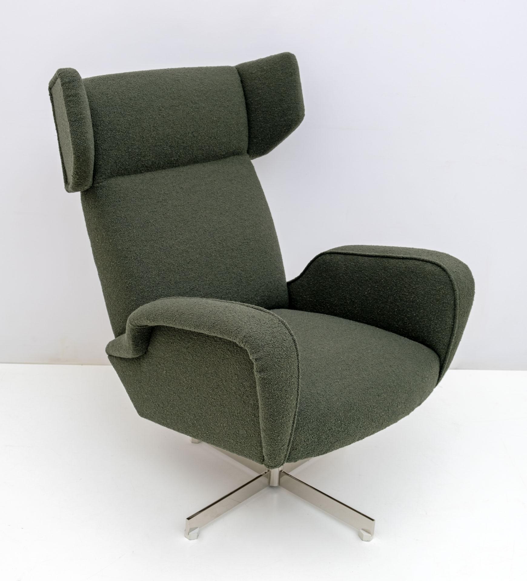 This armchair was produced in Italy in the 70s, it is swivel and rocking, with a high backrest, steel base. The armchair has been restored and has a new green Bouclè upholstery.