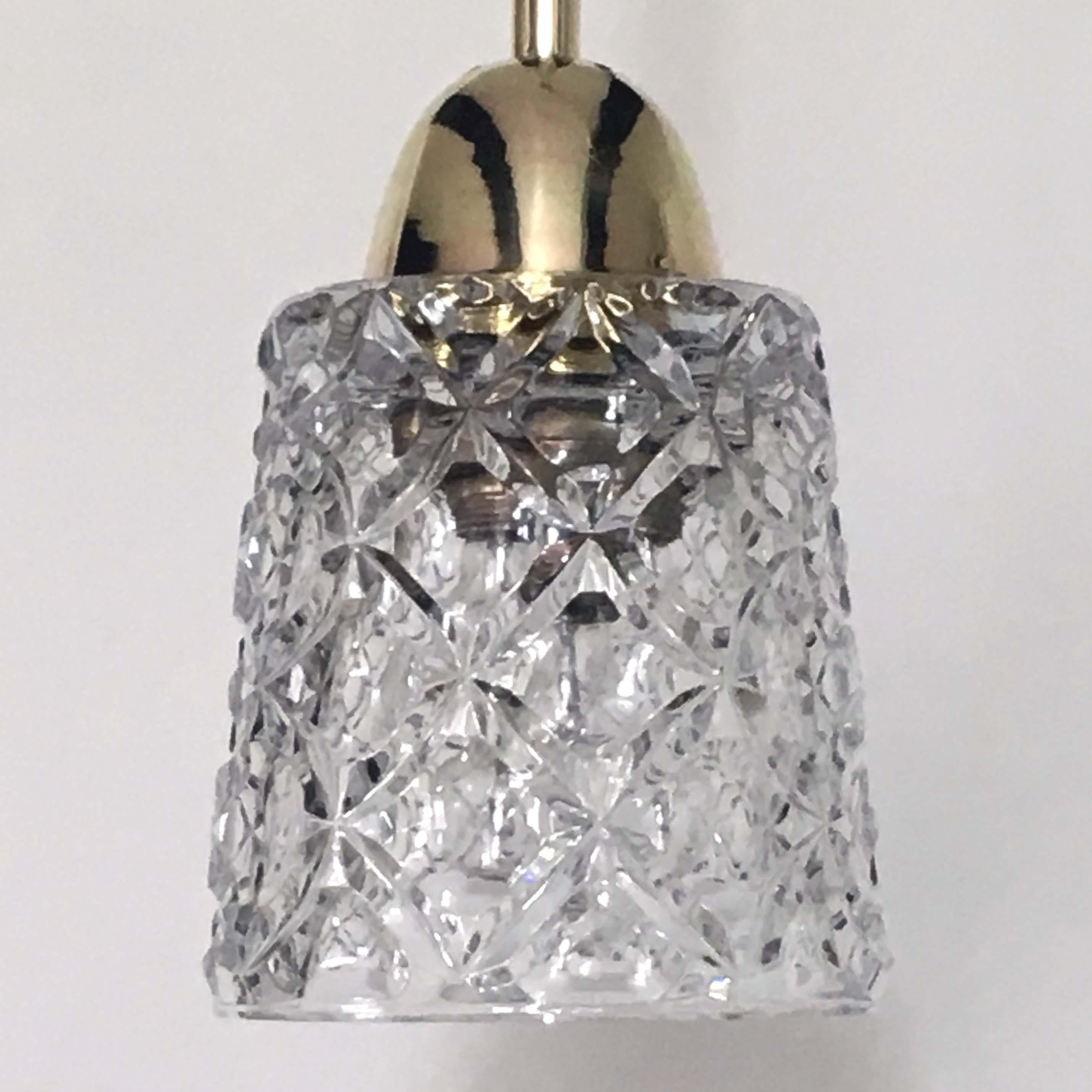 This elegant pendant was designed and made in Italy in the 1950s. The lamp is made of brass and has got a crystal cut glass shade. Excellent condition with one E27 socket. 

The lamp has been rewired and re-electrified for use in US. Total height