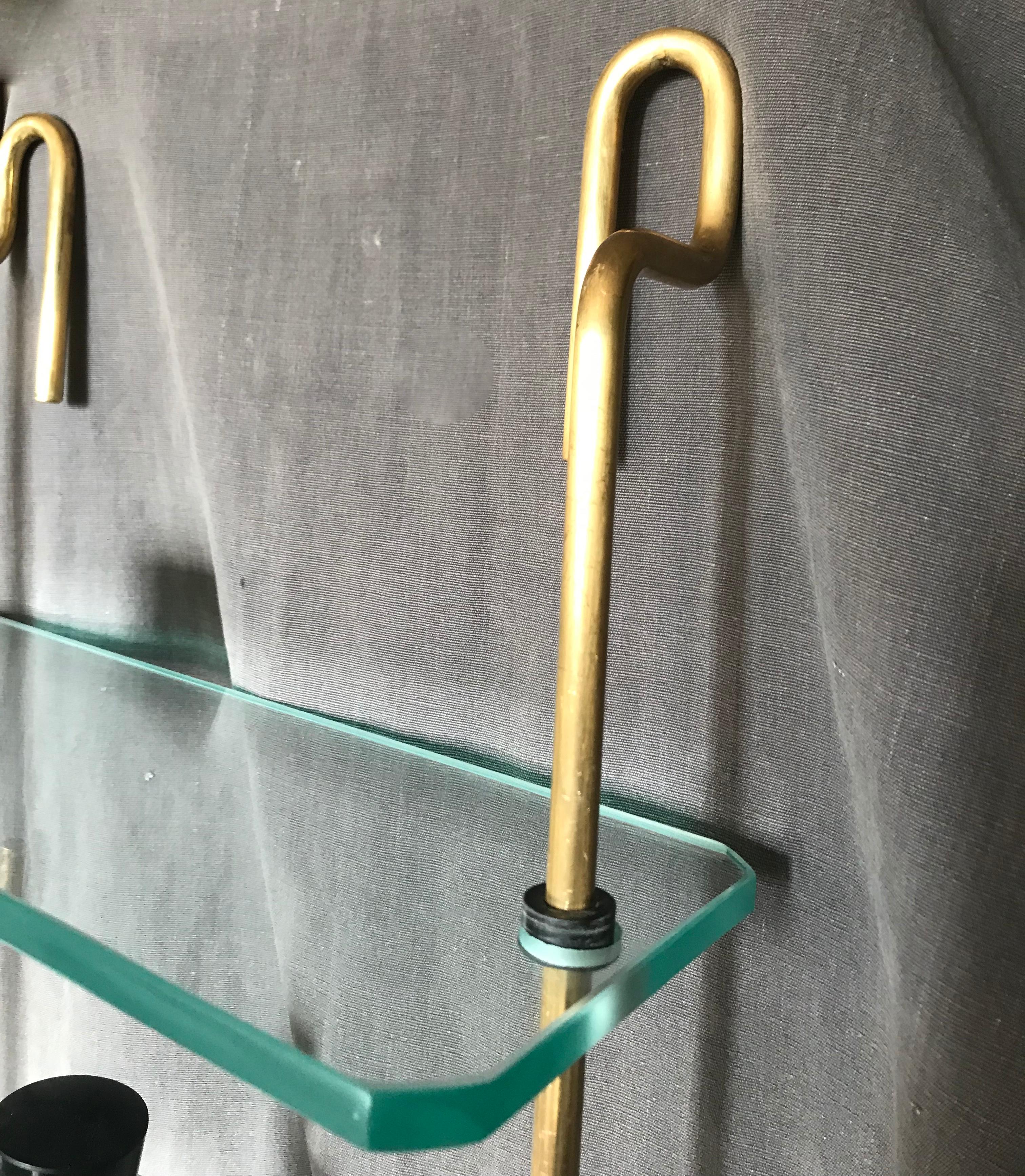 brass and glass hanging shelves