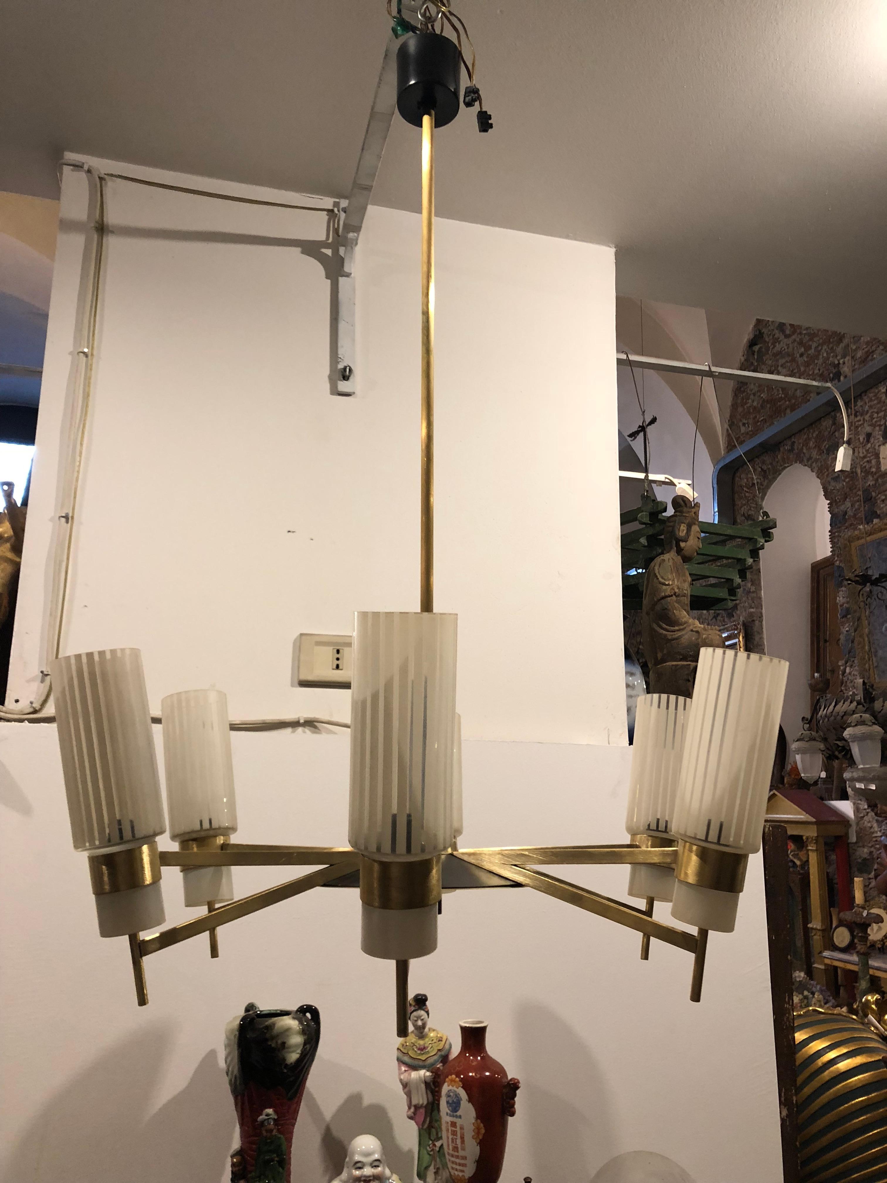 Stylish Mid-Century Modern brushed brass chandelier. Glasses in perfect conditions, it works with 110-240 volts and needs six regular e14 bulbs.