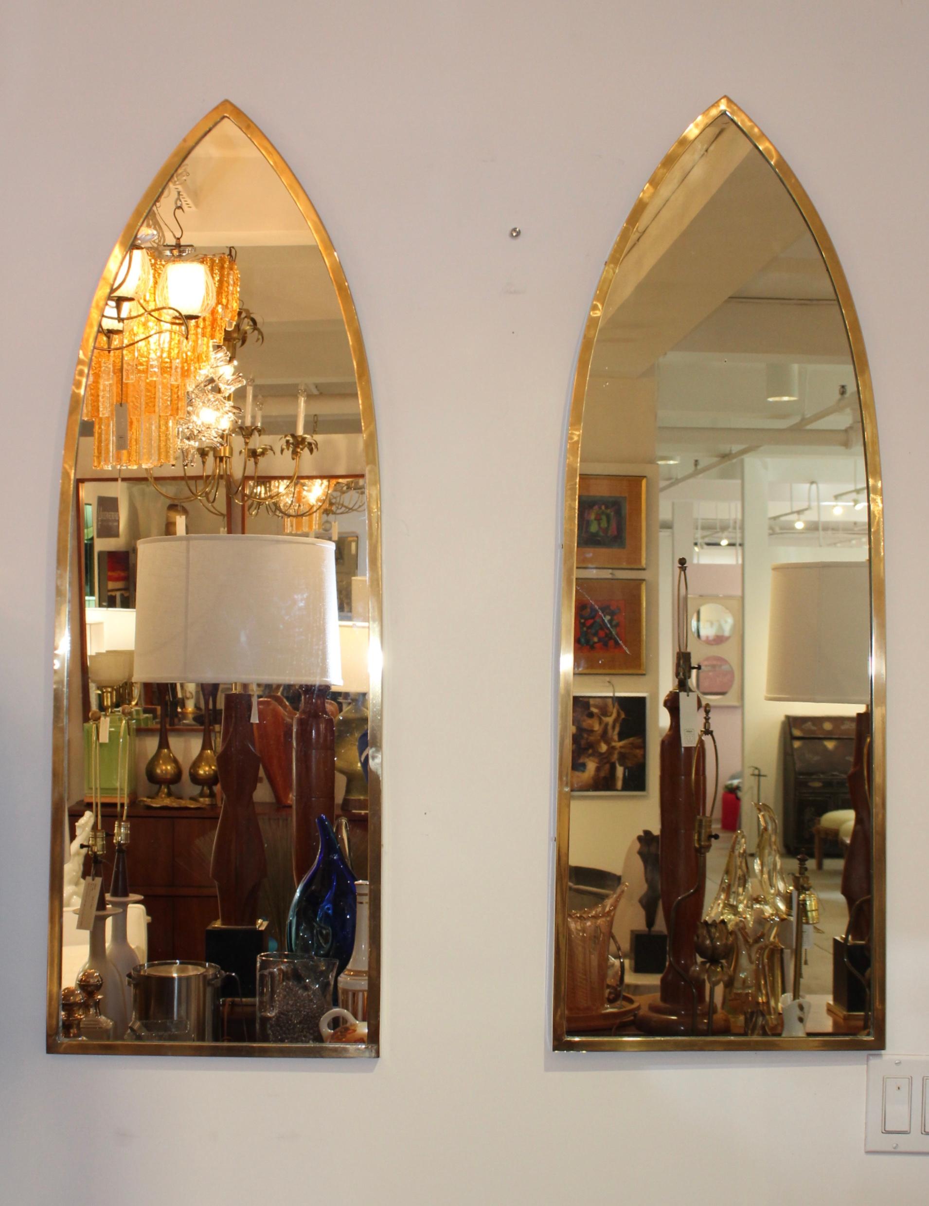 1950s solid brass Italian arched mirrors. Lightly hand polished.