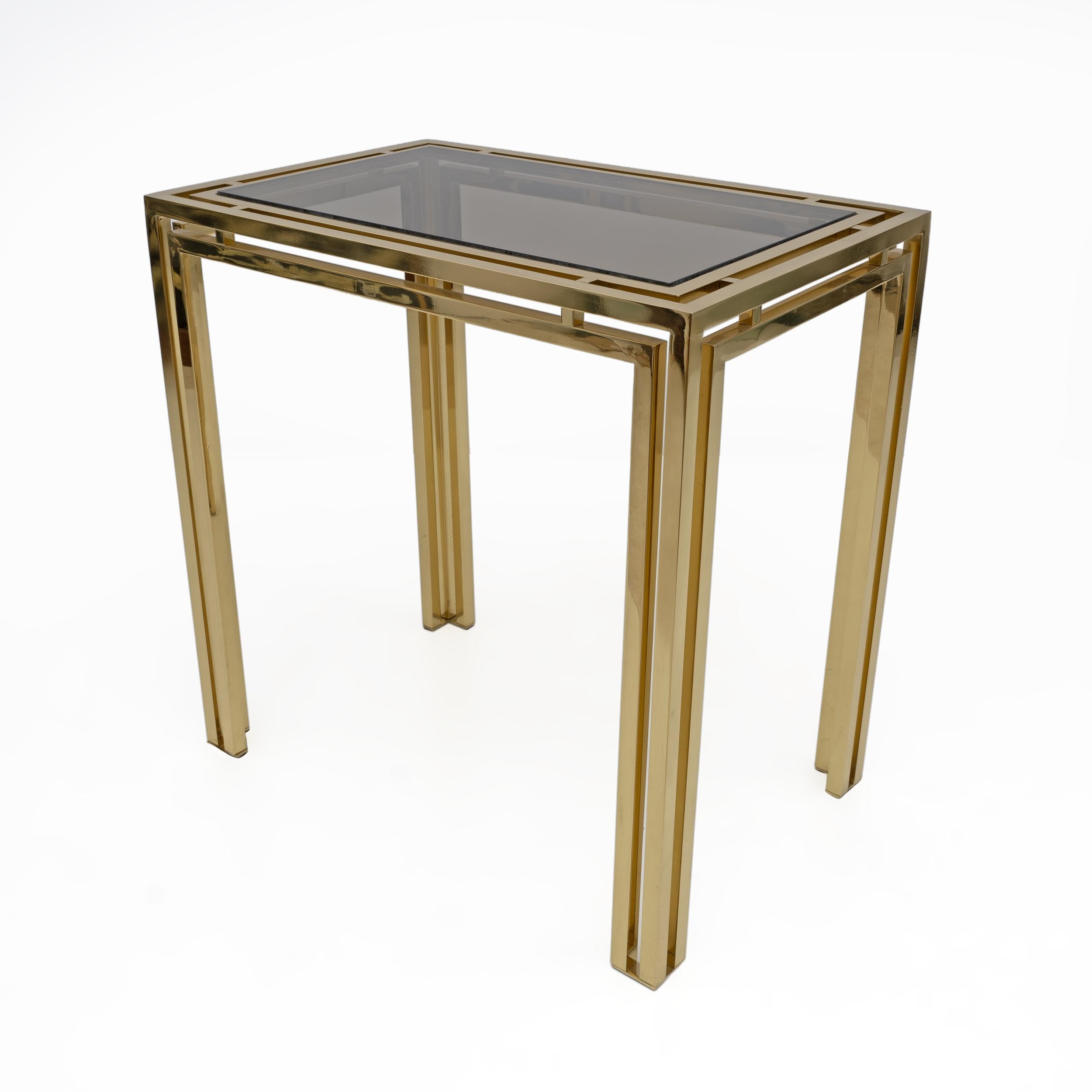 Mid-Century Modern Brass Console Table with Smoked Glass Top, Made in Italy in the 1970s. The frame is made of thick brass, kept in excellent condition, as shown in the photos
