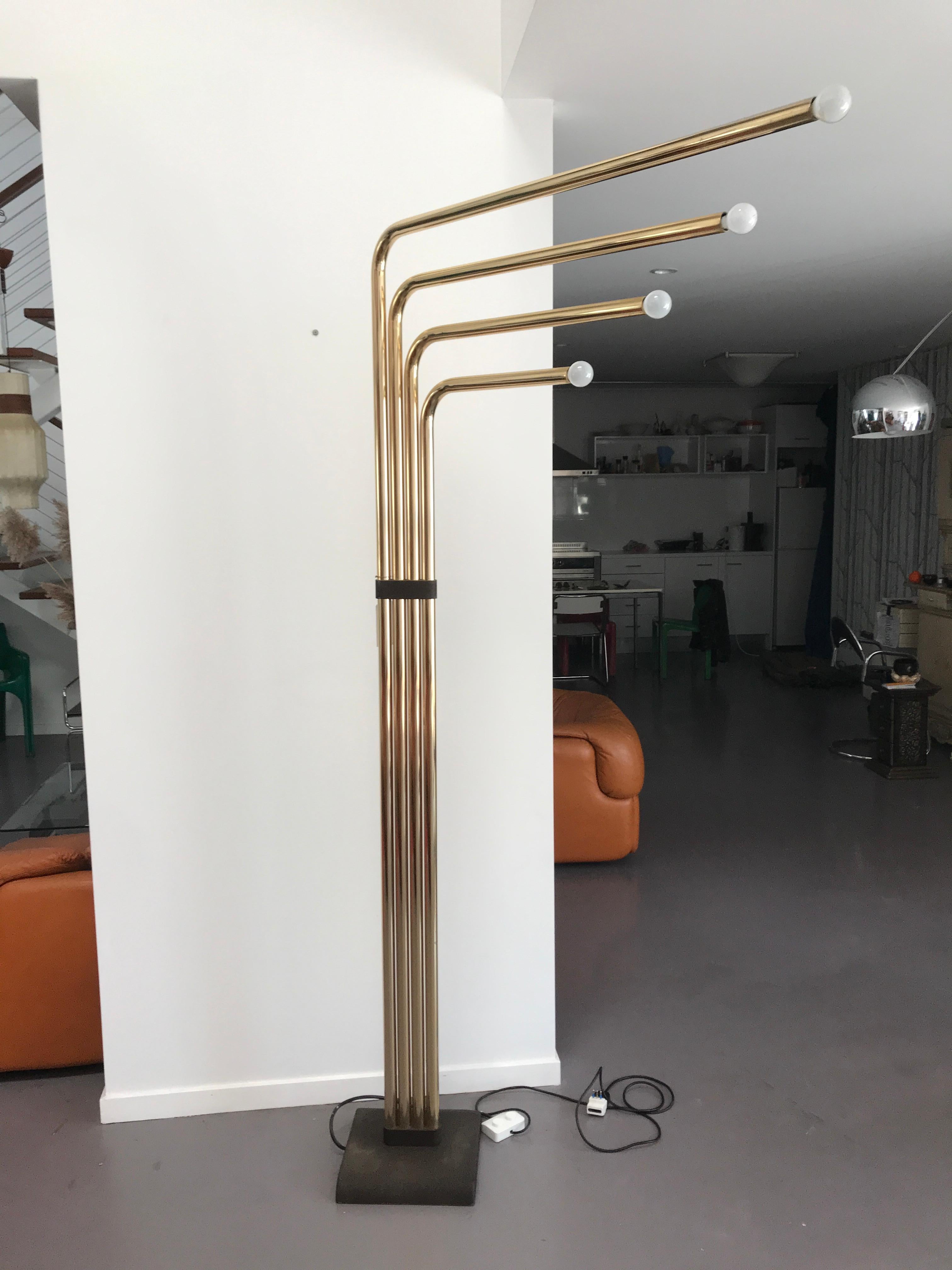 Brass floor lamp by Goffredo Reggiani for Reggiani Illuminazione, 1974. Reggiani uses chrome, opal glass and teak, to create Space Age designs, such Sputnik-style chandeliers or floor lamps with trumpet-shaped diffusers. This floor lamp has a solid