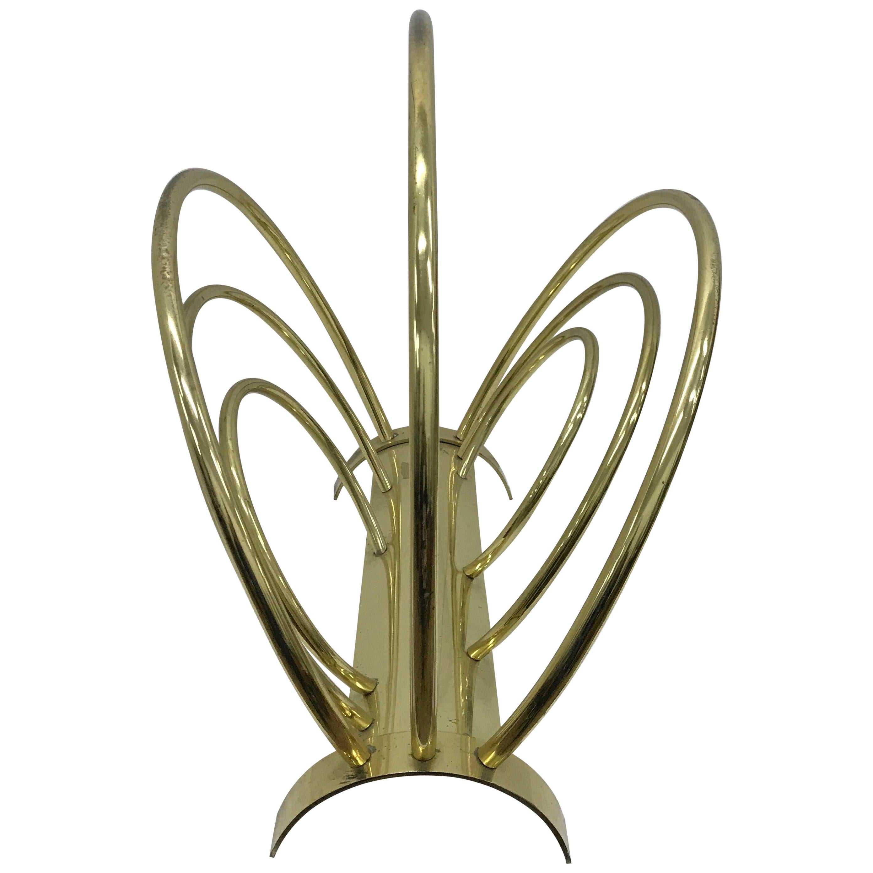This is a brass magazine rack designed and manufactured in Italy in the 1950s, good conditions overall, brass is in original patina.
This Italian Magazine it's a stylish and functional piece of furniture that embodies the design sensibilities of the