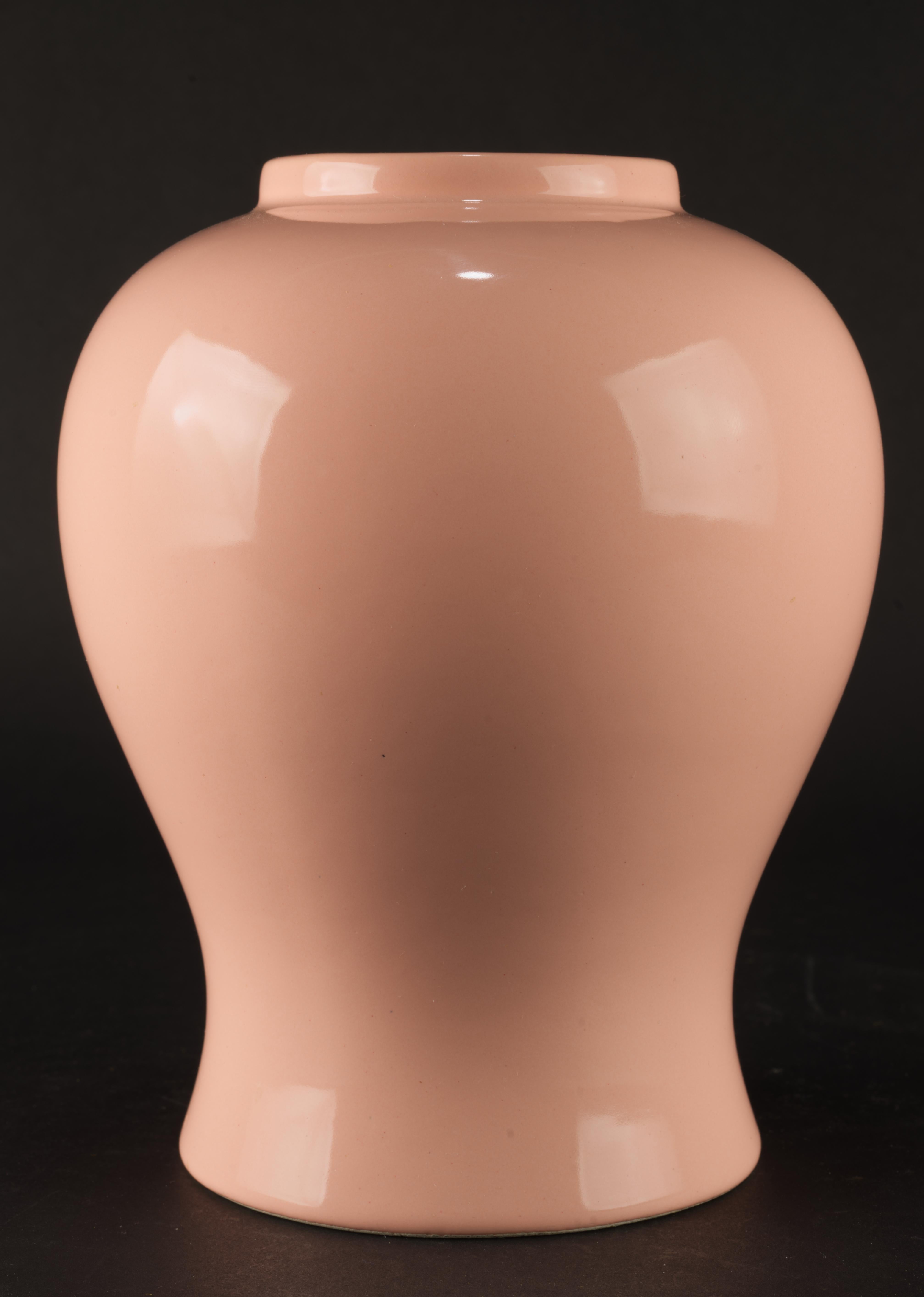 Mid-century modern ceramic vase was made in Italy for Americal importer. Its sleek and elegant form combines functional beauty and meticulous craftsmanship. The vase is finished with monochromatic glaze in complex shade of coral pink. It original