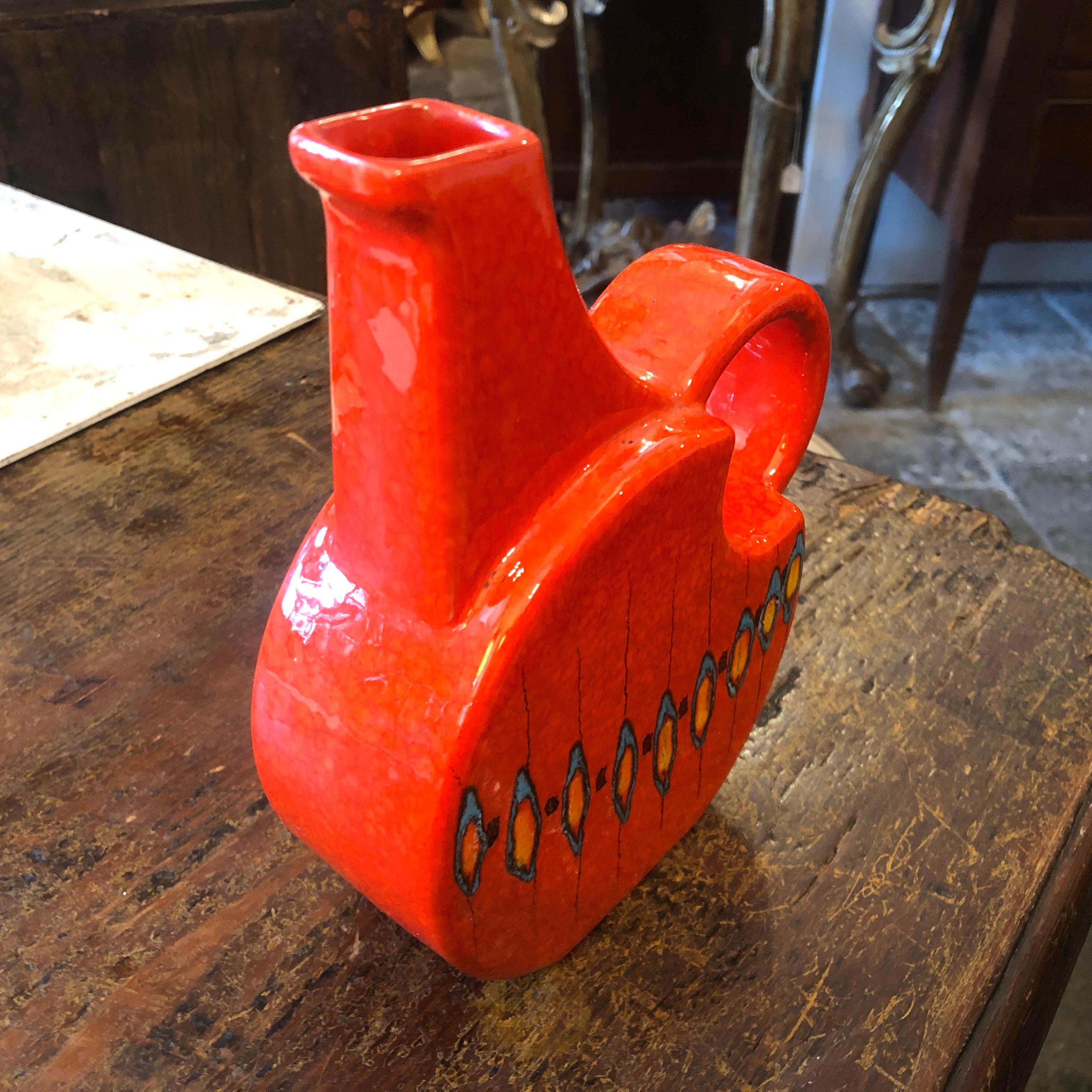 A Memphis style Italian Jug by Bertoncello, the red ceramic jug is in perfect conditions.