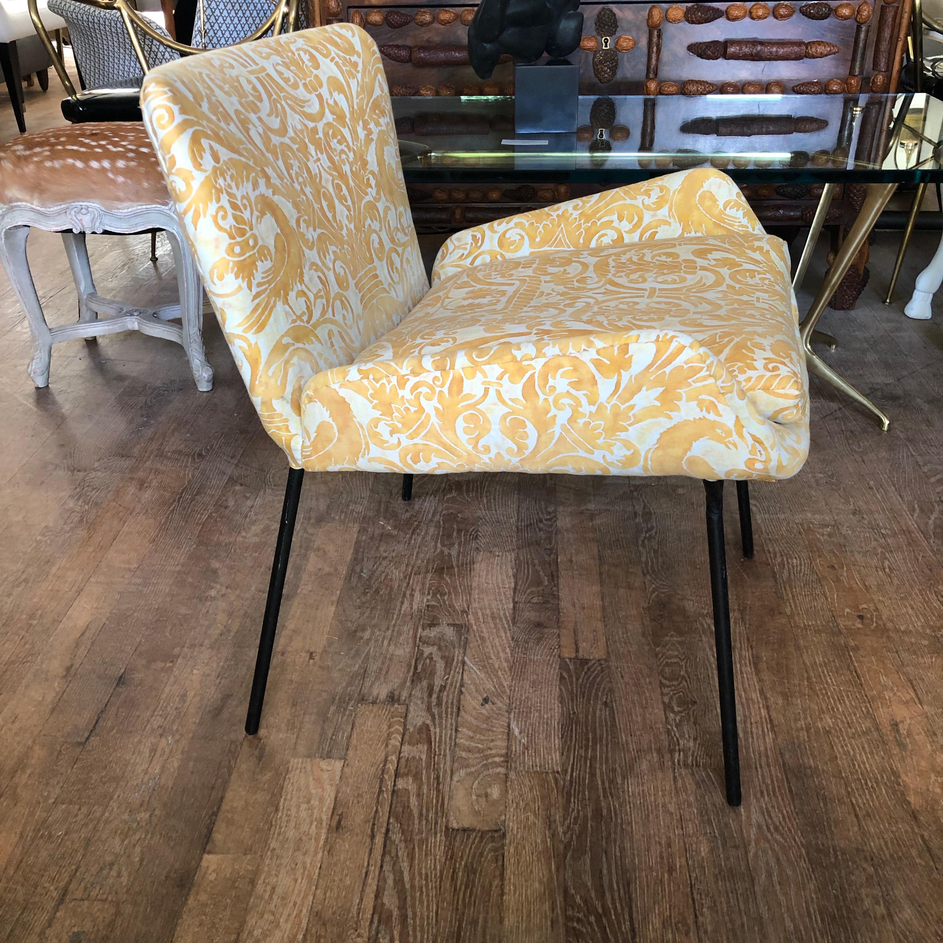 Whimsical midcentury Italian chair newly upholstered in a cheery and sophisticated yellow Fortuny cotton. It has an iron frame.