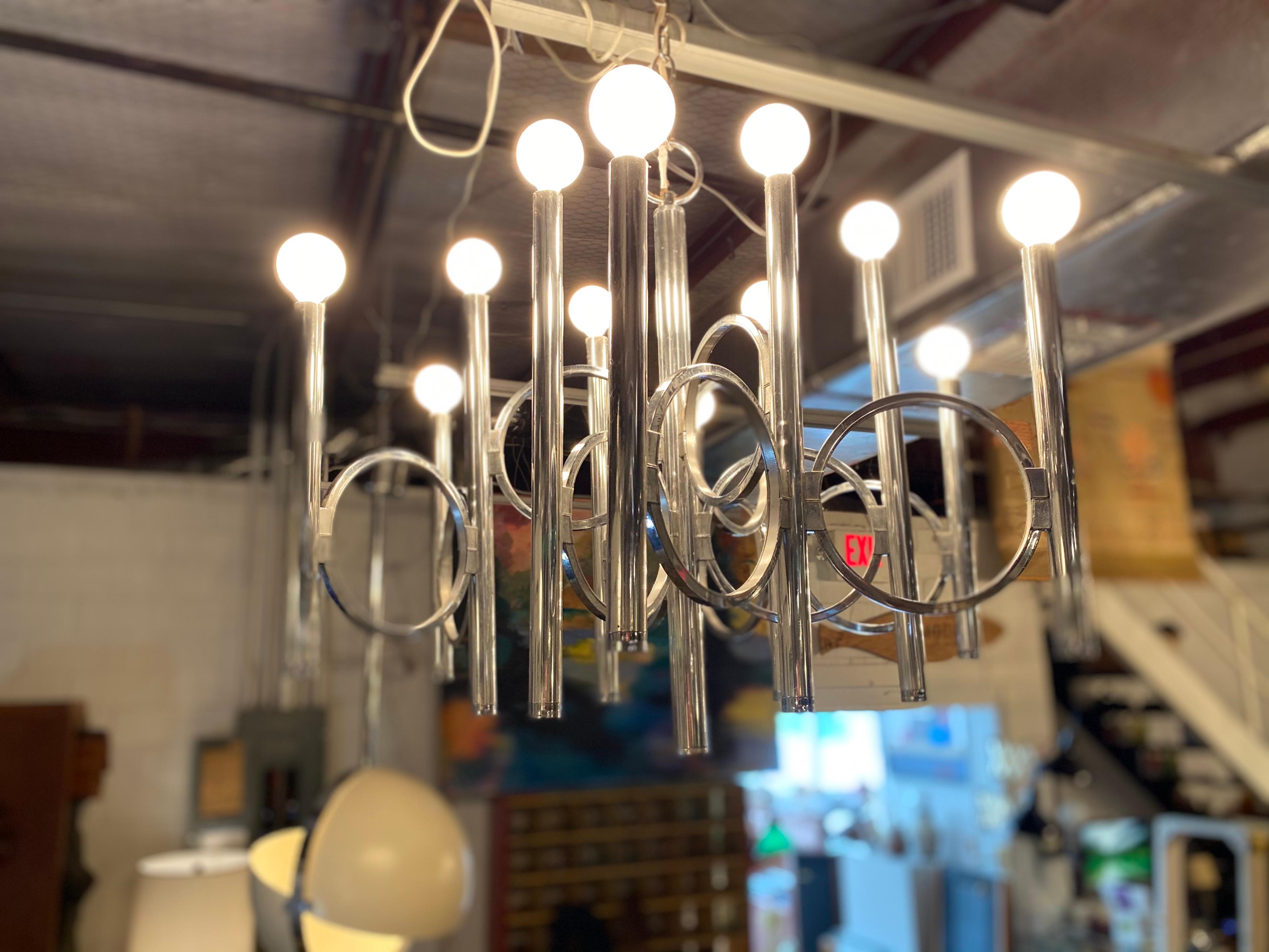 Chrome Mid-Century Modern Italian chandelier by Gaetano Sciolari for Lightolier, Hollywood Regency. Takes 12 bulbs and is in overall great condition.