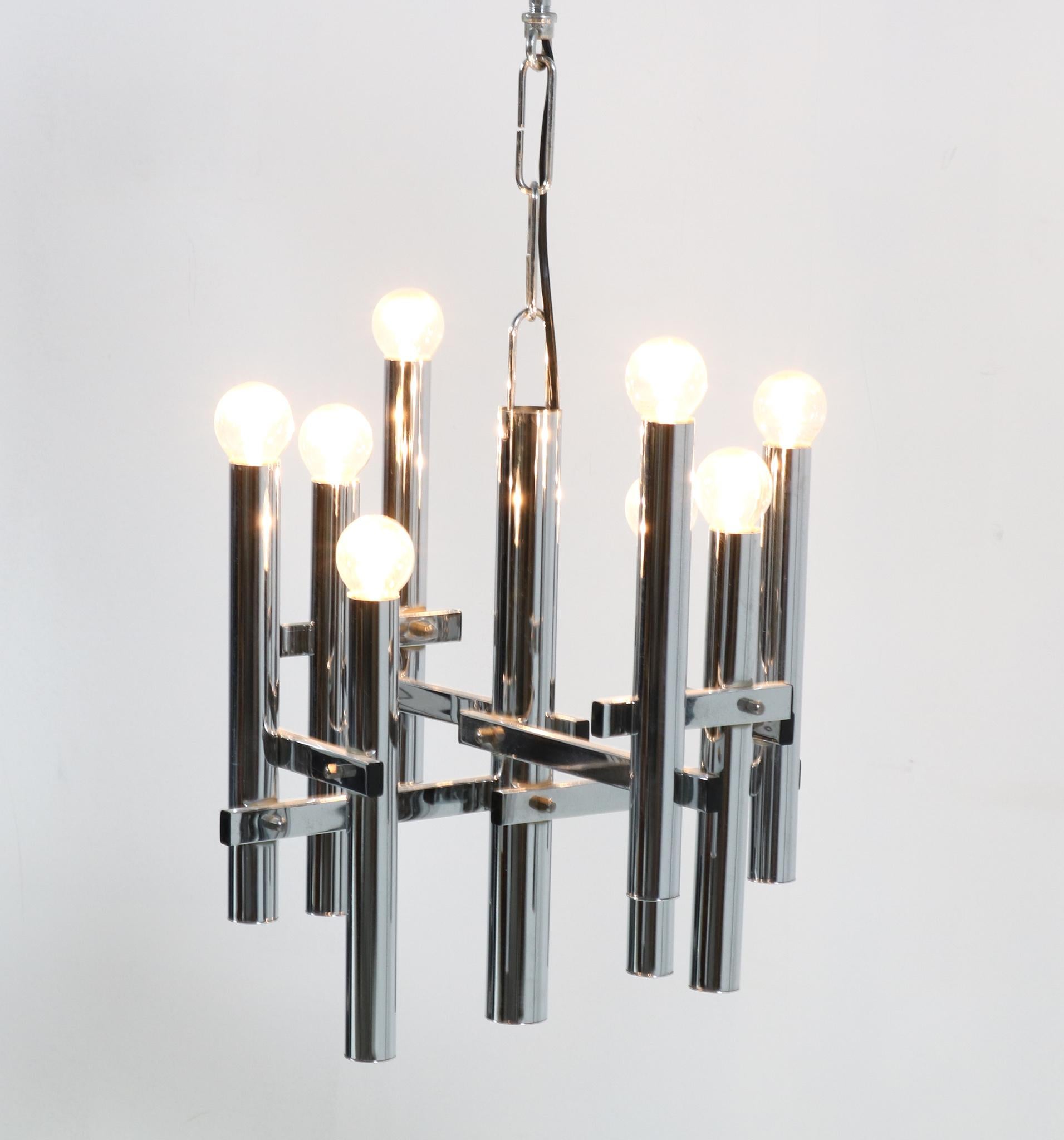 Stunning Mid-Century Modern Chandelier.
In the style of Gaetano Sciolari.
Striking Italian design from the 1970s.
Chrome base with eight original sockets for E-24 lightbulbs.
In good original condition with a beautiful patina.