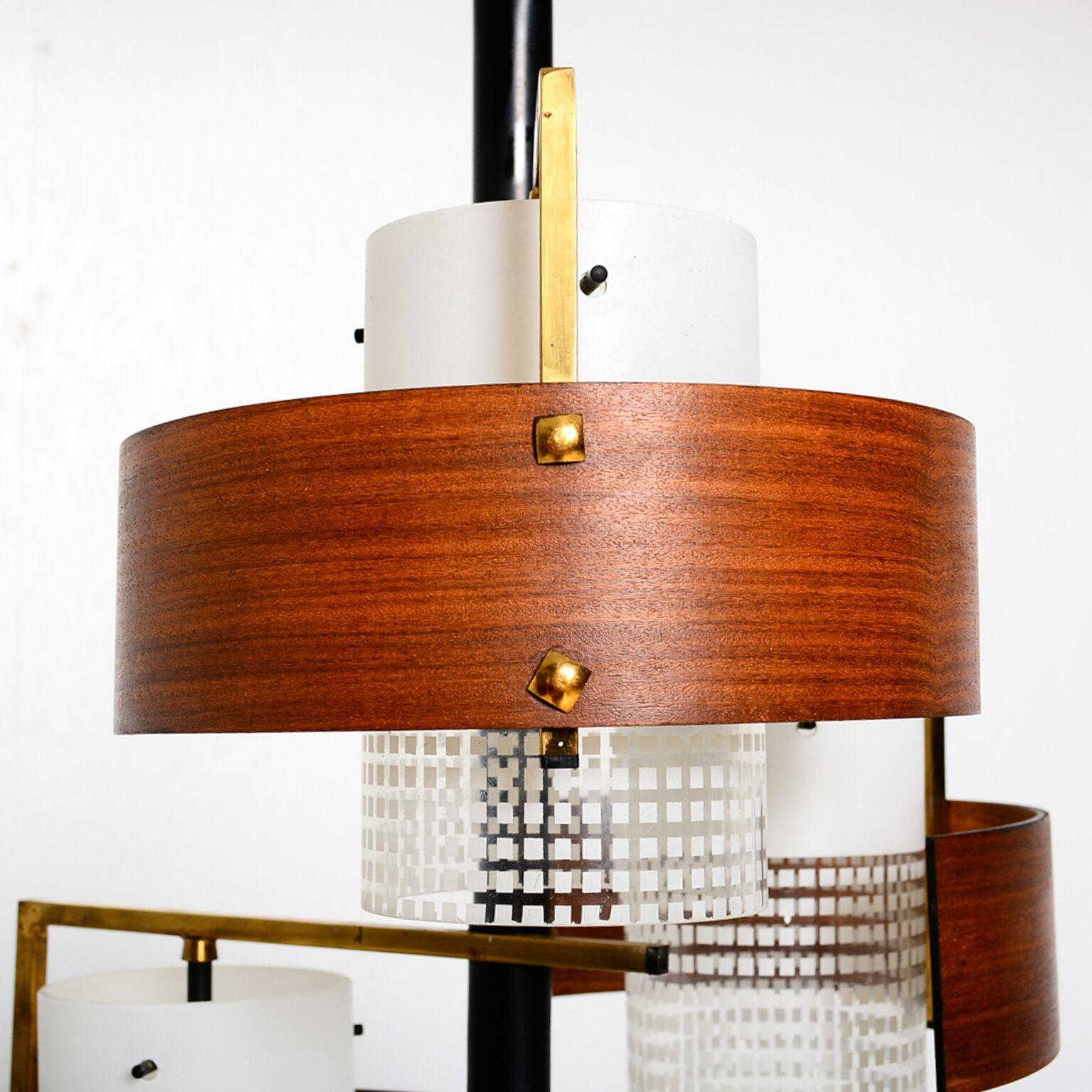 For your consideration a vintage Italian chandelier with glass and bent teak plywood diffusers.

The fixture requires three (3) E14 bulbs, not included.

Made in Italy, circa 1960s. Attributed to Stilux. No maker label present.

Very good